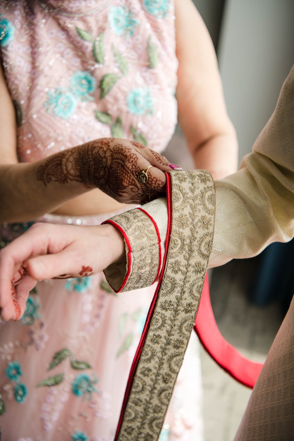 Chicago Wedding Photographer | Renaissance Schaumburg | J. Brown Photography | groom gets dressed on wedding day.