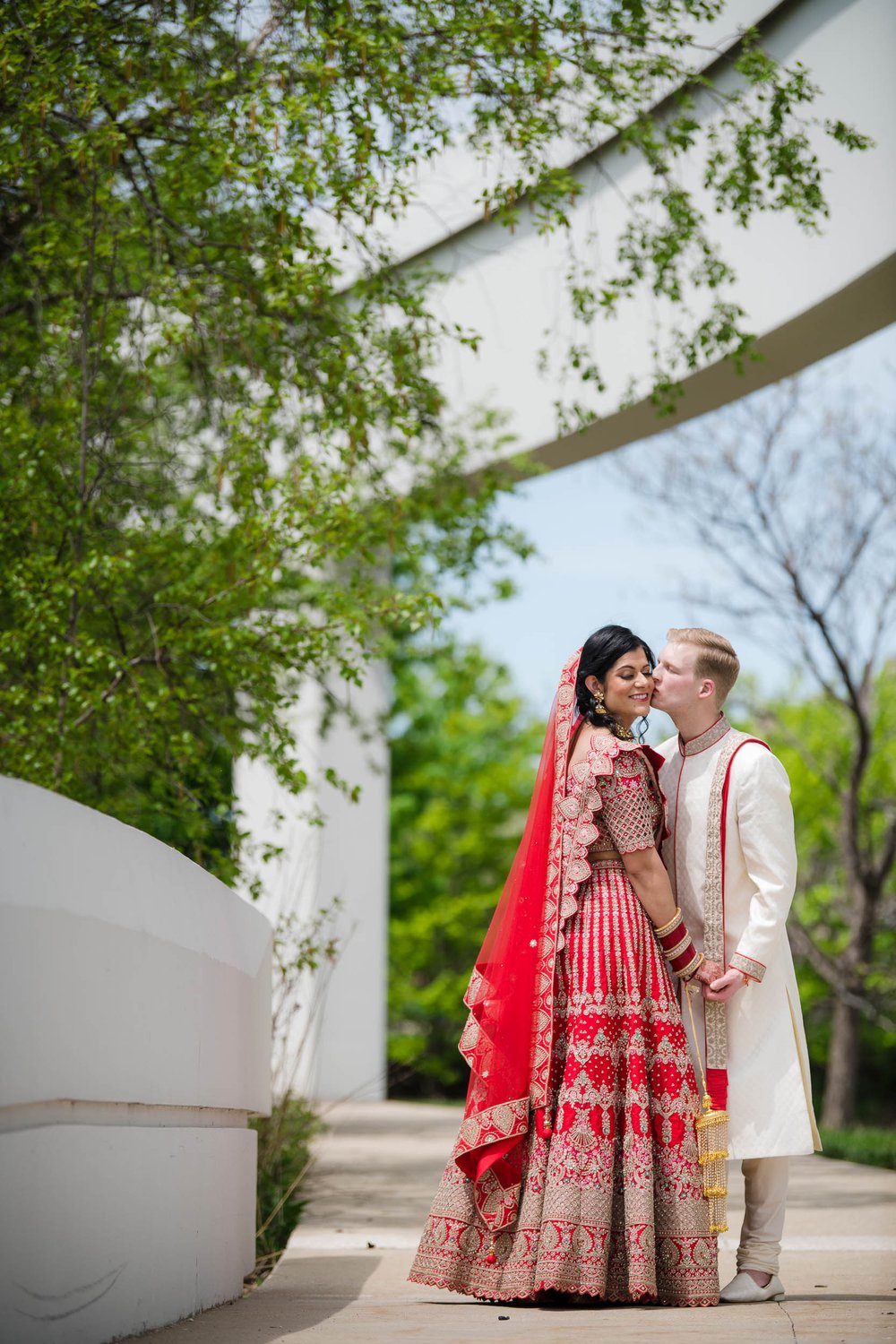 Indian Wedding Photographers Chicago | Renaissance Schaumburg | J. Brown Photography | bride and groom kiss.  