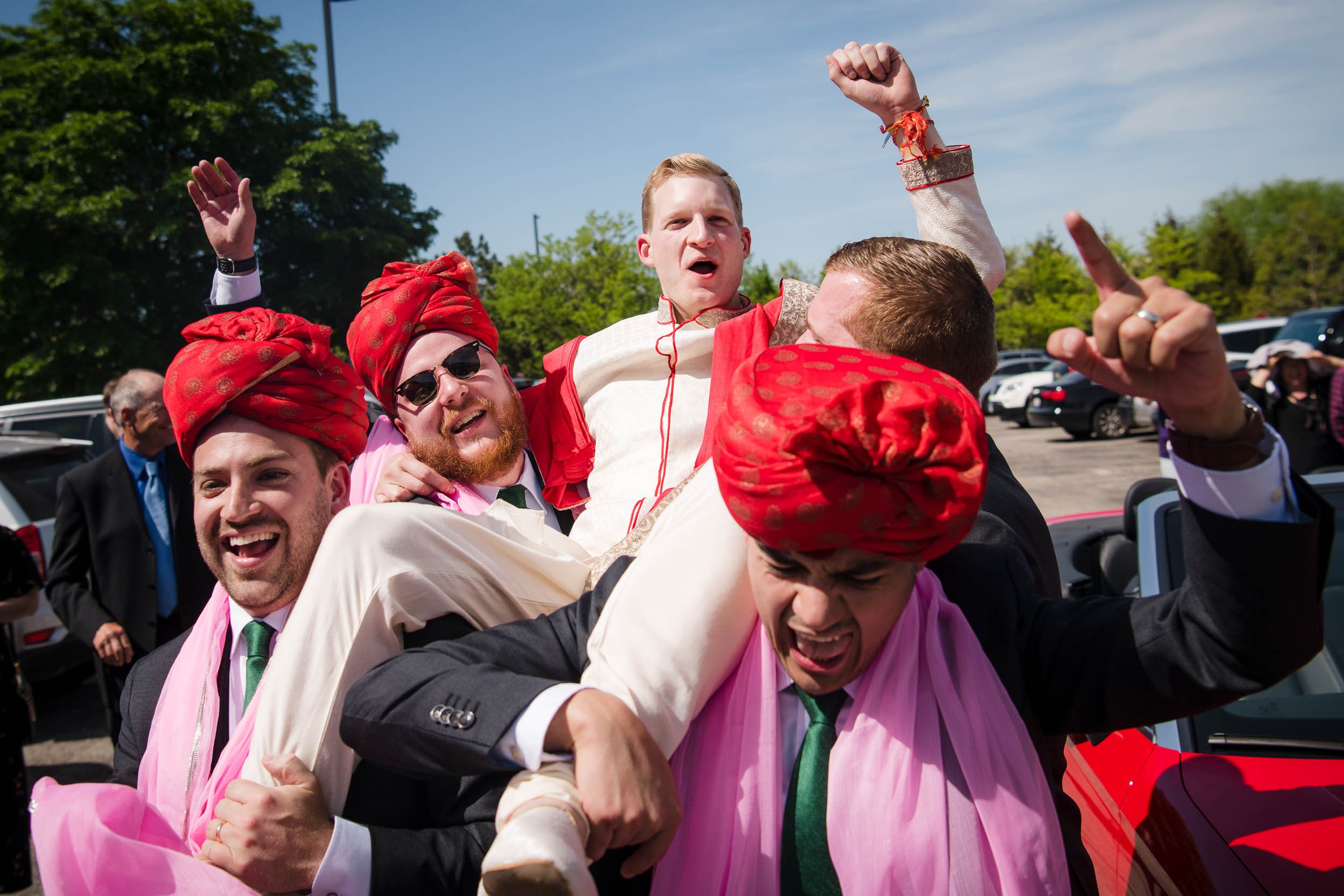 Chicago Wedding Photographer | Renaissance Schaumburg | J. Brown Photography | groom is carried during the baraat.