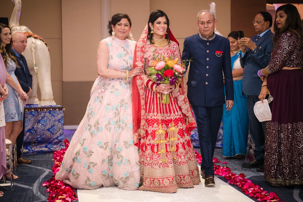 Indian Wedding Photographers | Renaissance Schaumburg | J. Brown Photography | bride walks down the aisle during ceremony.