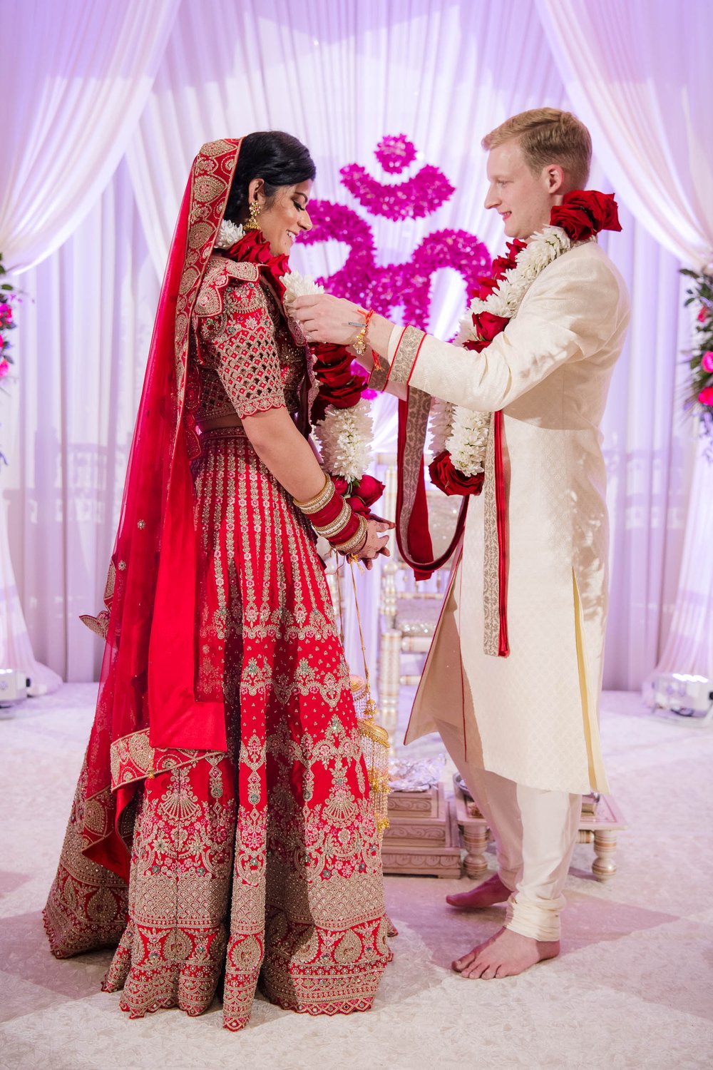 Indian Wedding Photographers | Renaissance Schaumburg | J. Brown Photography | bride and groom exchange garlands.  