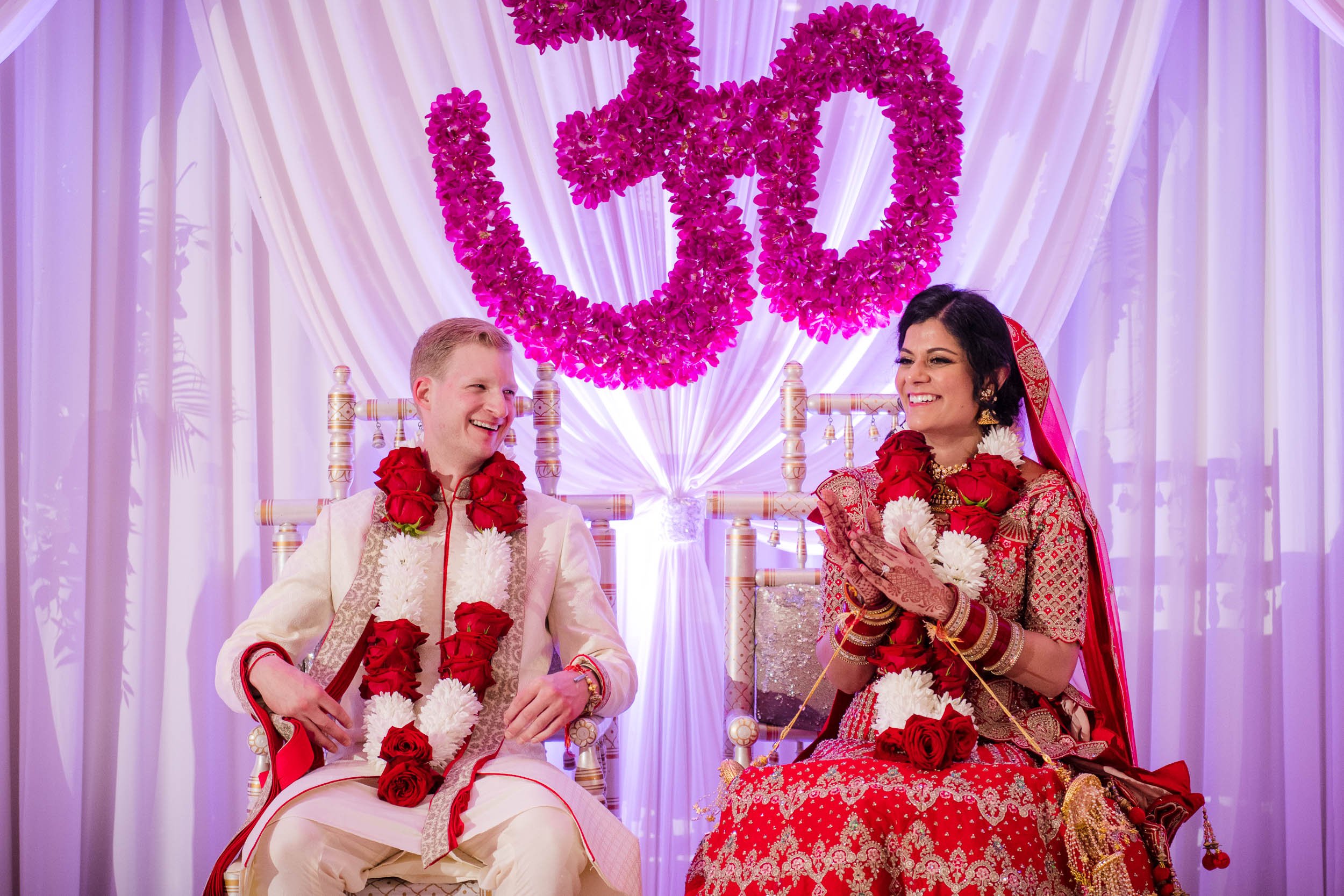 Indian Wedding Photographers | Renaissance Schaumburg | J. Brown Photography | bride and groom laugh during ceremony.