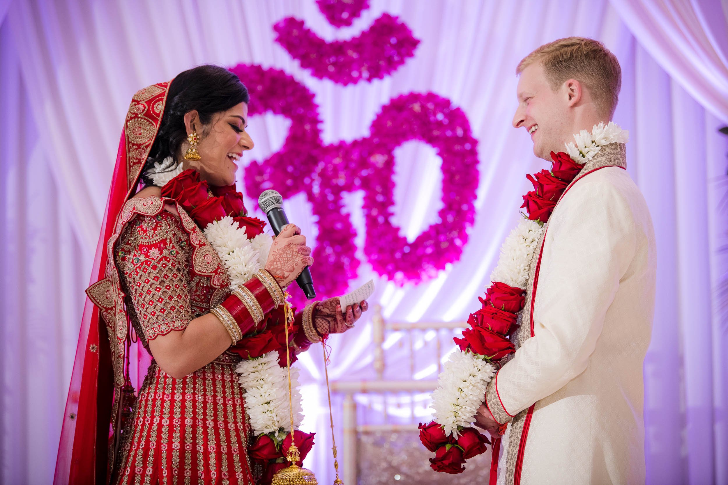 Indian Wedding Photographers | Renaissance Schaumburg | J. Brown Photography | bride and groom exchange vows during ceremony.