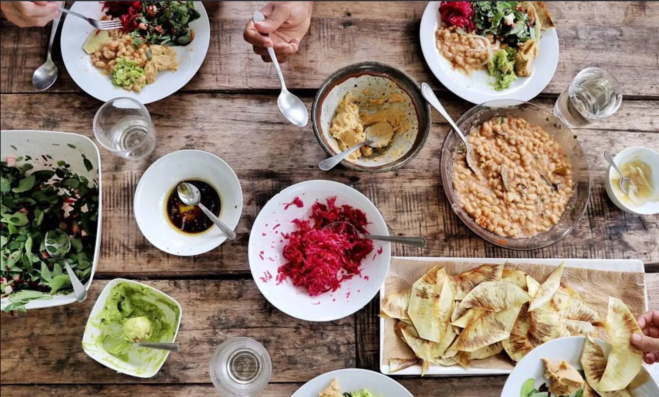Shared farm-to-table meal made with tropical vegetables, roots, and homemade dishes at Finca Tierra in Costa Rica