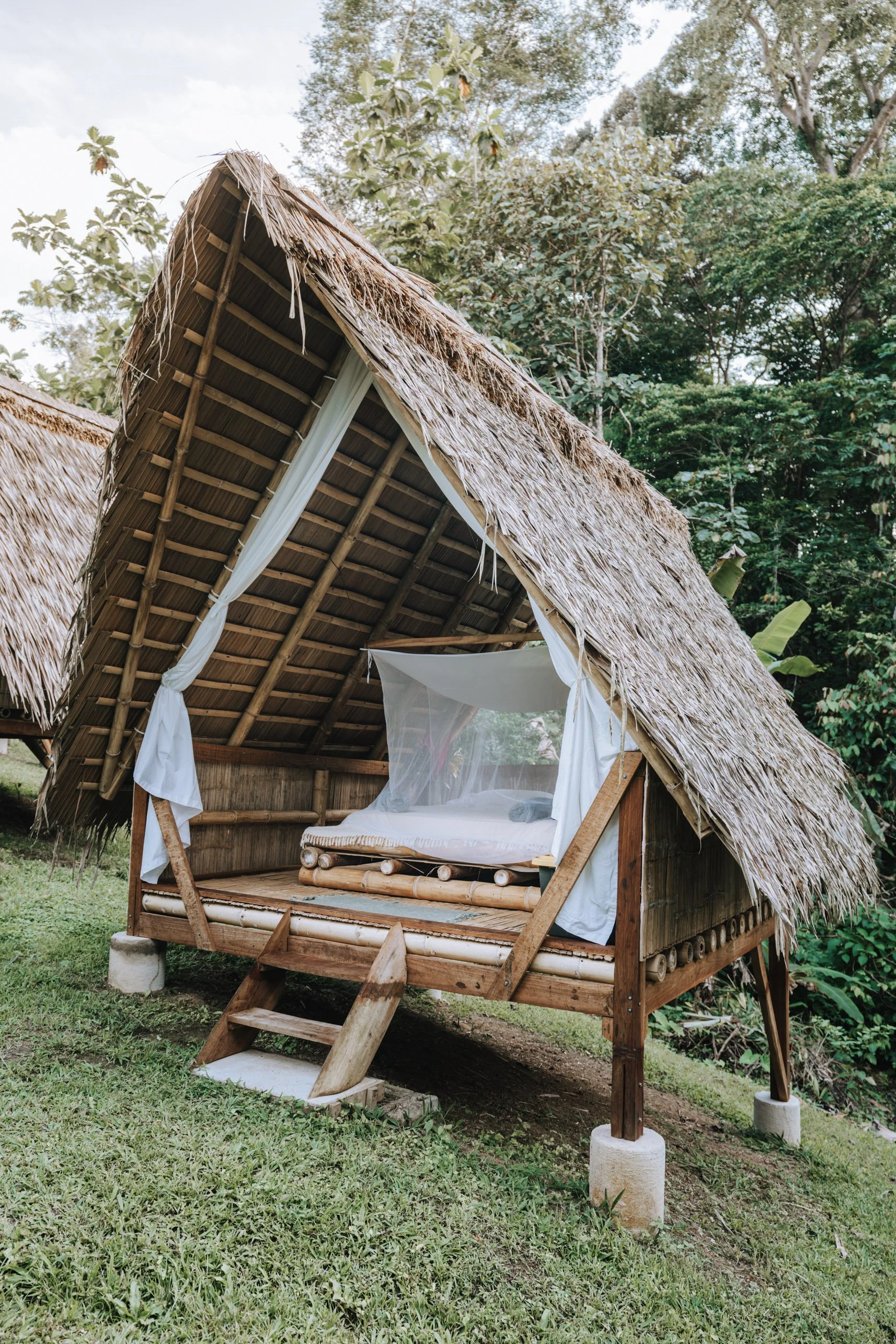 Private off-grid bamboo cabin surrounded by rainforest at a Costa Rica garden-to-table retreat