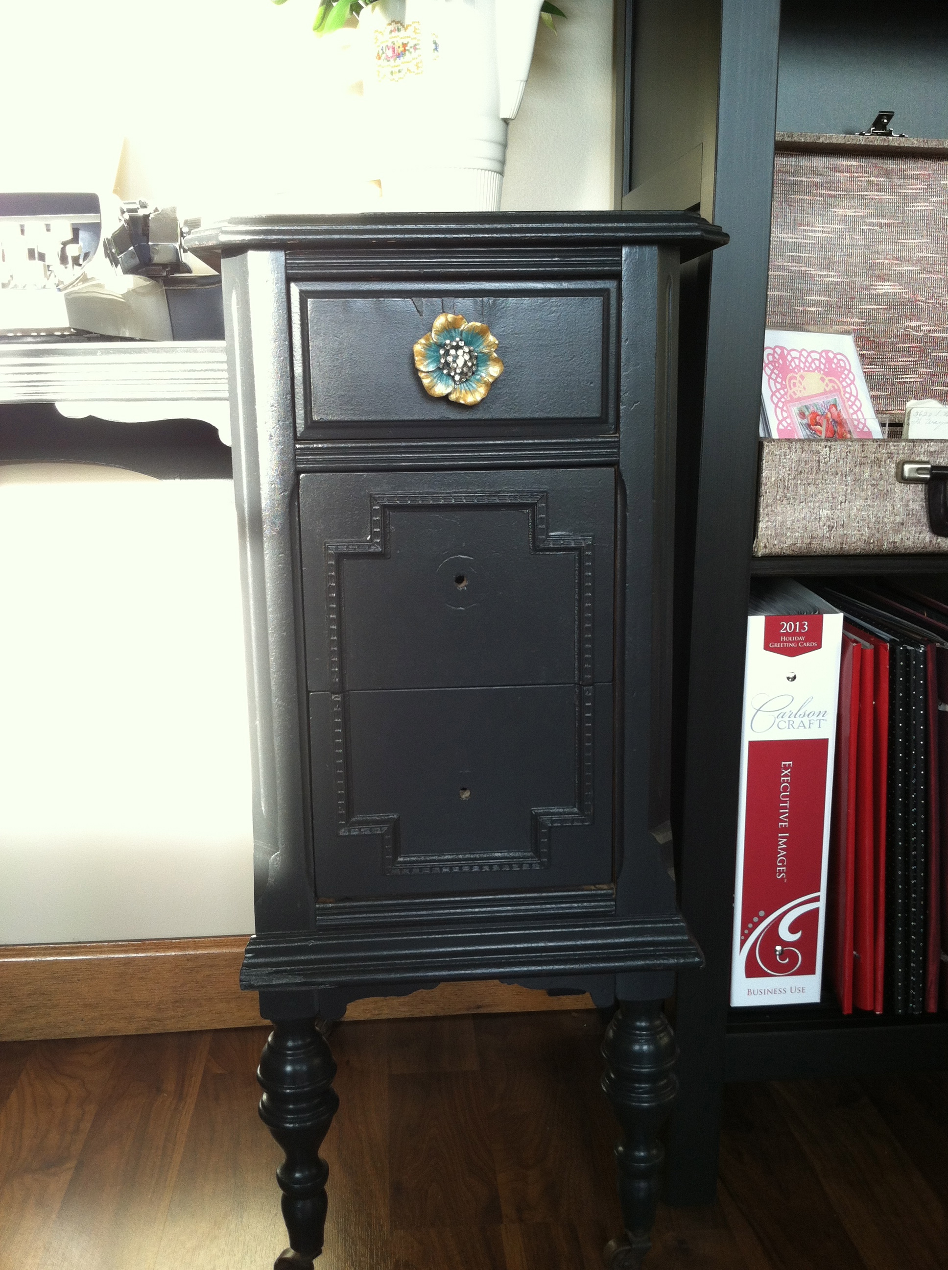 I painted this piece a safe and solid black and added the cute knobs. It needed something extra but I couldn't find the time to do it.