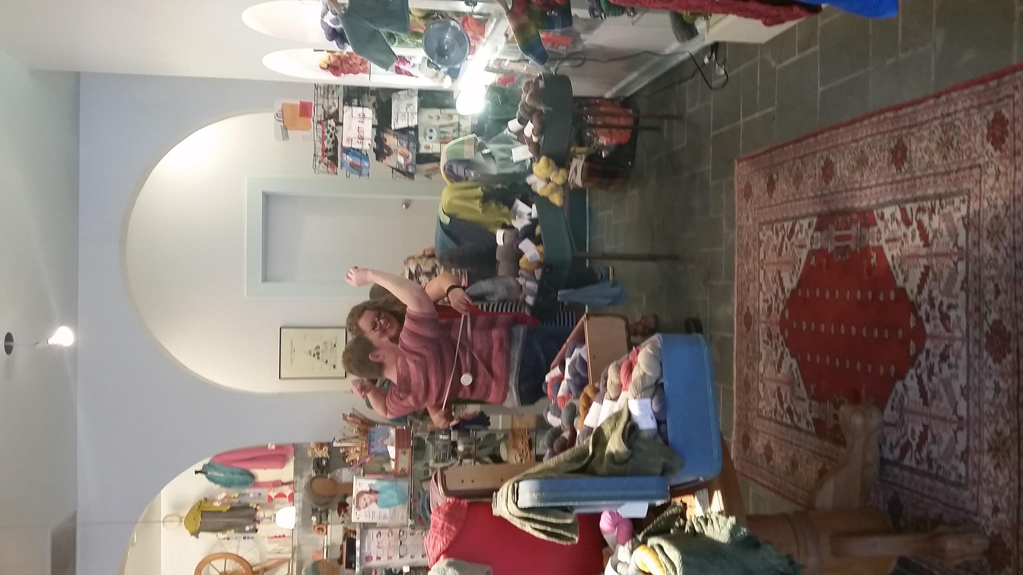 Sizing at Mosaic, she loved the sweater so much, she didn't want to take it off. 