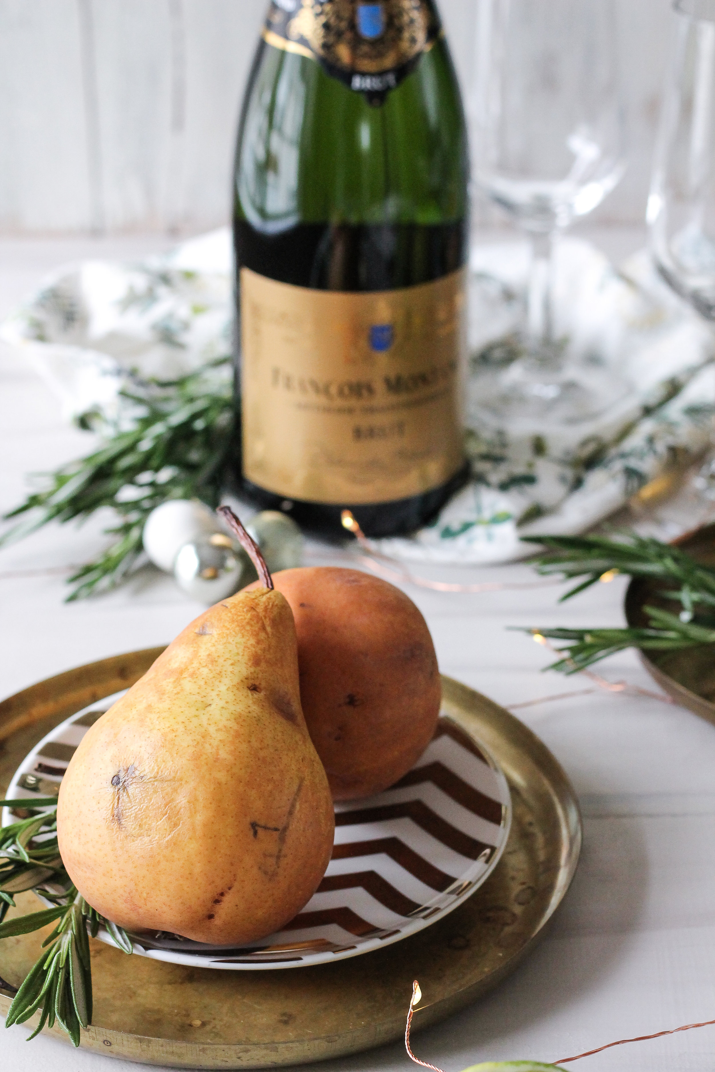 Champagne Poached Pears with Rosemary &amp; Lime make the perfect New Year's Eve treat!  Find the super simple recipe on www.pedanticfoodie.com!!!