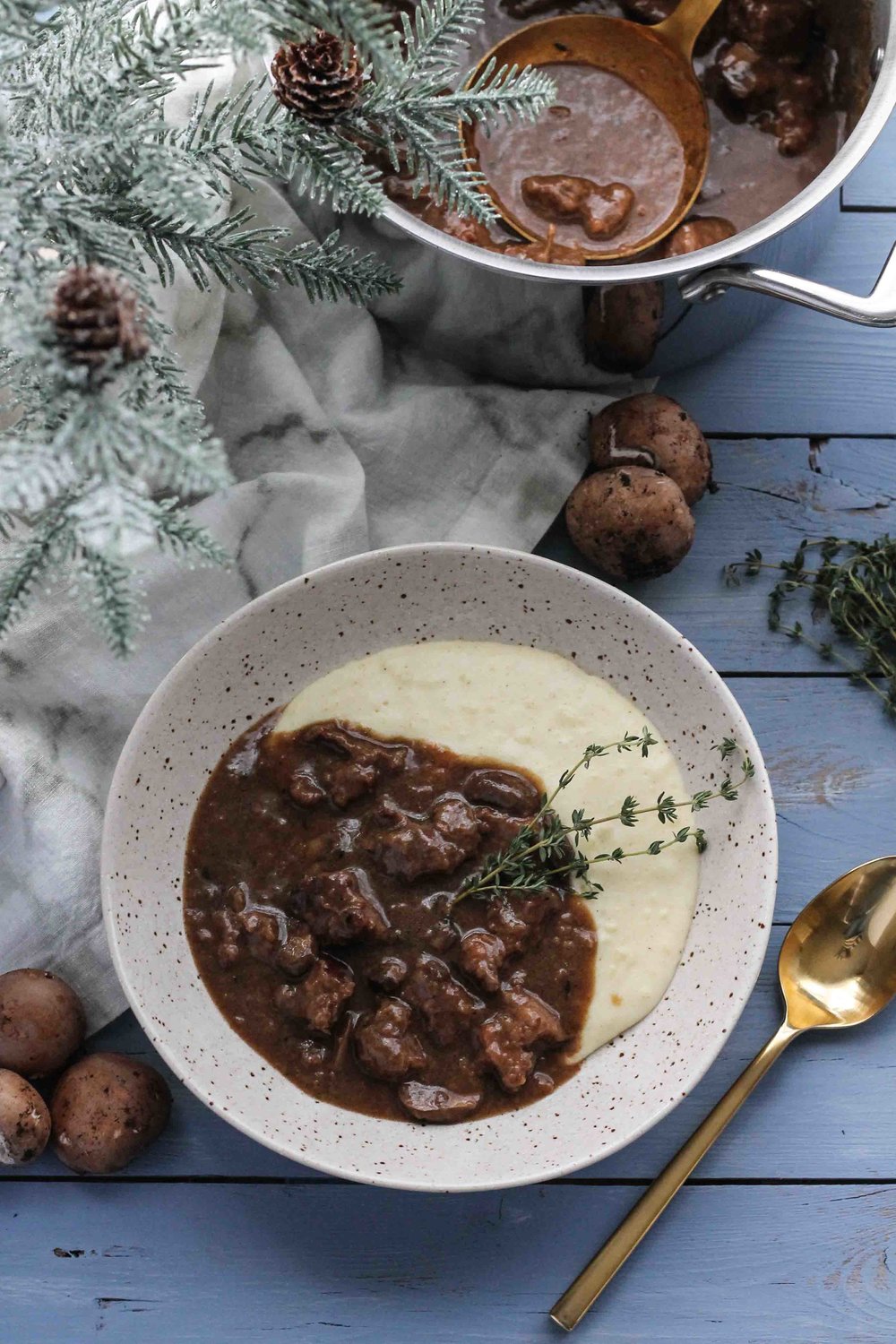 Classic+beef+and+mushroom+stew+becomes+the+perfect+cozy,+winter+meal+when+ladled+over+a+spoonful+of+brown+butter+mashed+potatoes.++[www.pedanticfoodie.jpg