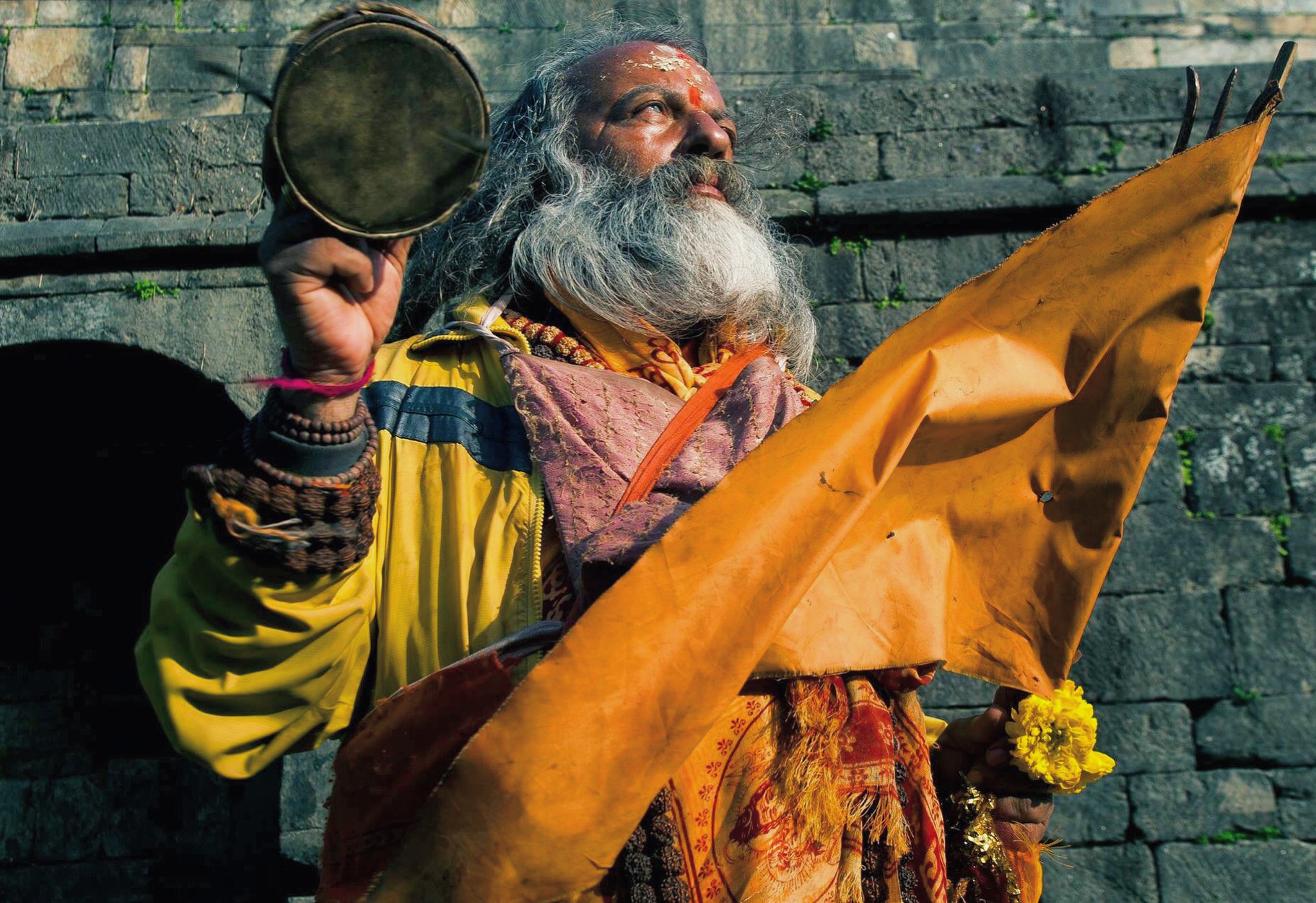 A sadhu, or holy man, originally from England prays in the setting sun on Pashupatinath's western bank. 