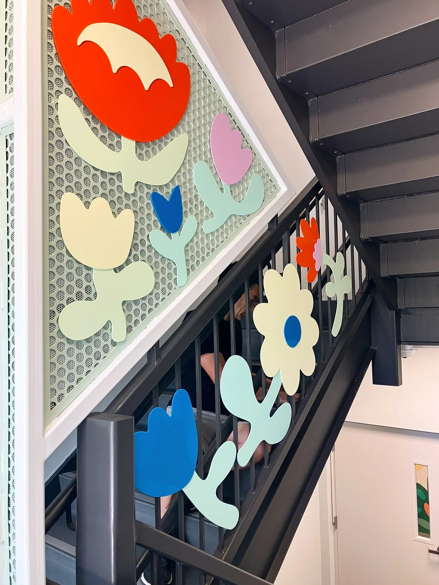 We were lucky enough to go back to @familyaidboston to continue our floral designs into the entry stairwell, this time as 2 dimensional floral sculptures!

Made out of cut acrylic, these flowers add some dimension and much needed color into the space