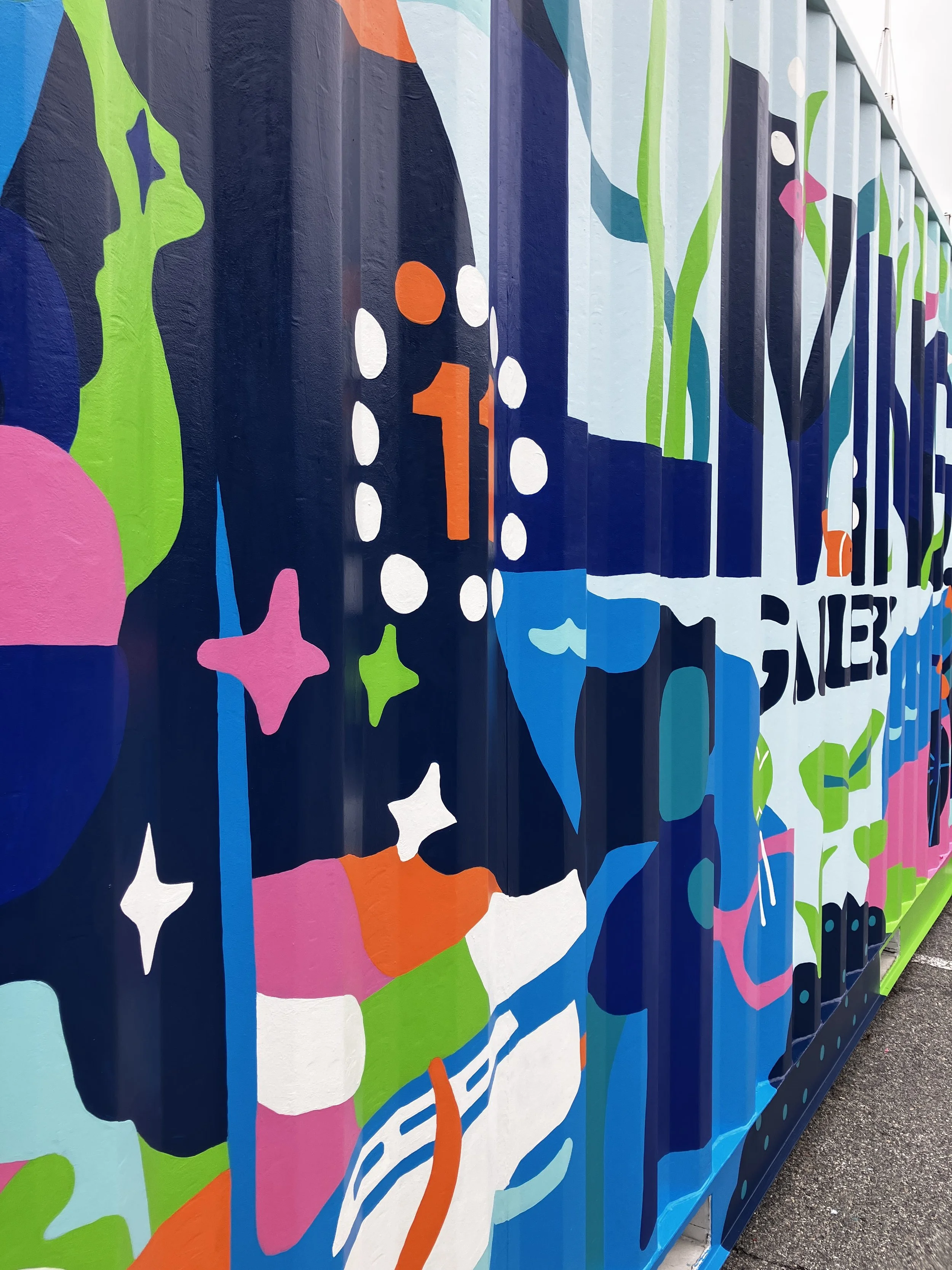 Close up image of the commissioned large scale mural on a metal shipping container