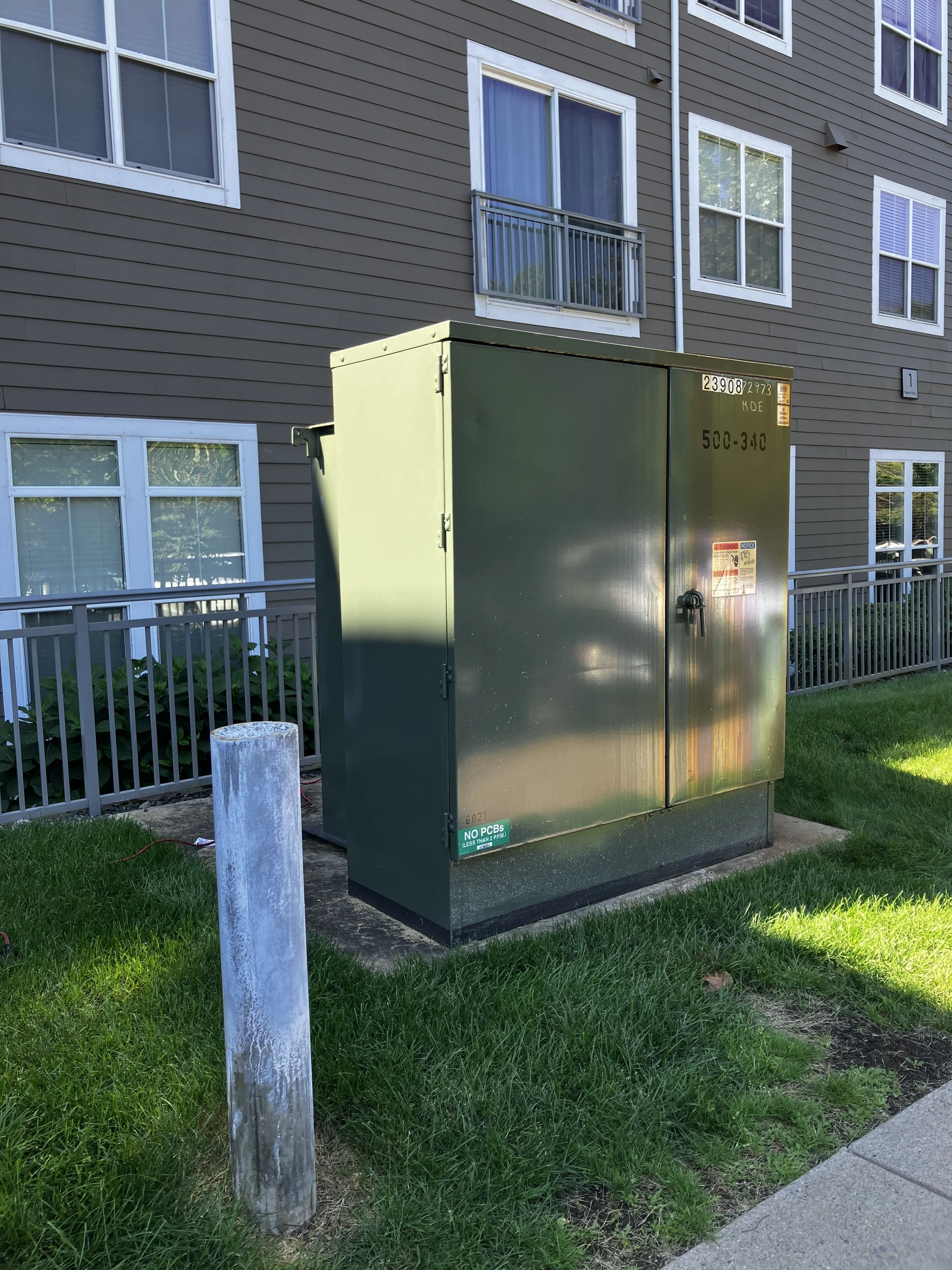 Before photo of the large utility box at the apartment complex Watertown Mews in Watertown, MA. 