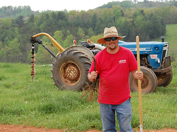 Planting our first vine, April 2009. Dianne calls this one 'Farmer Jeff'