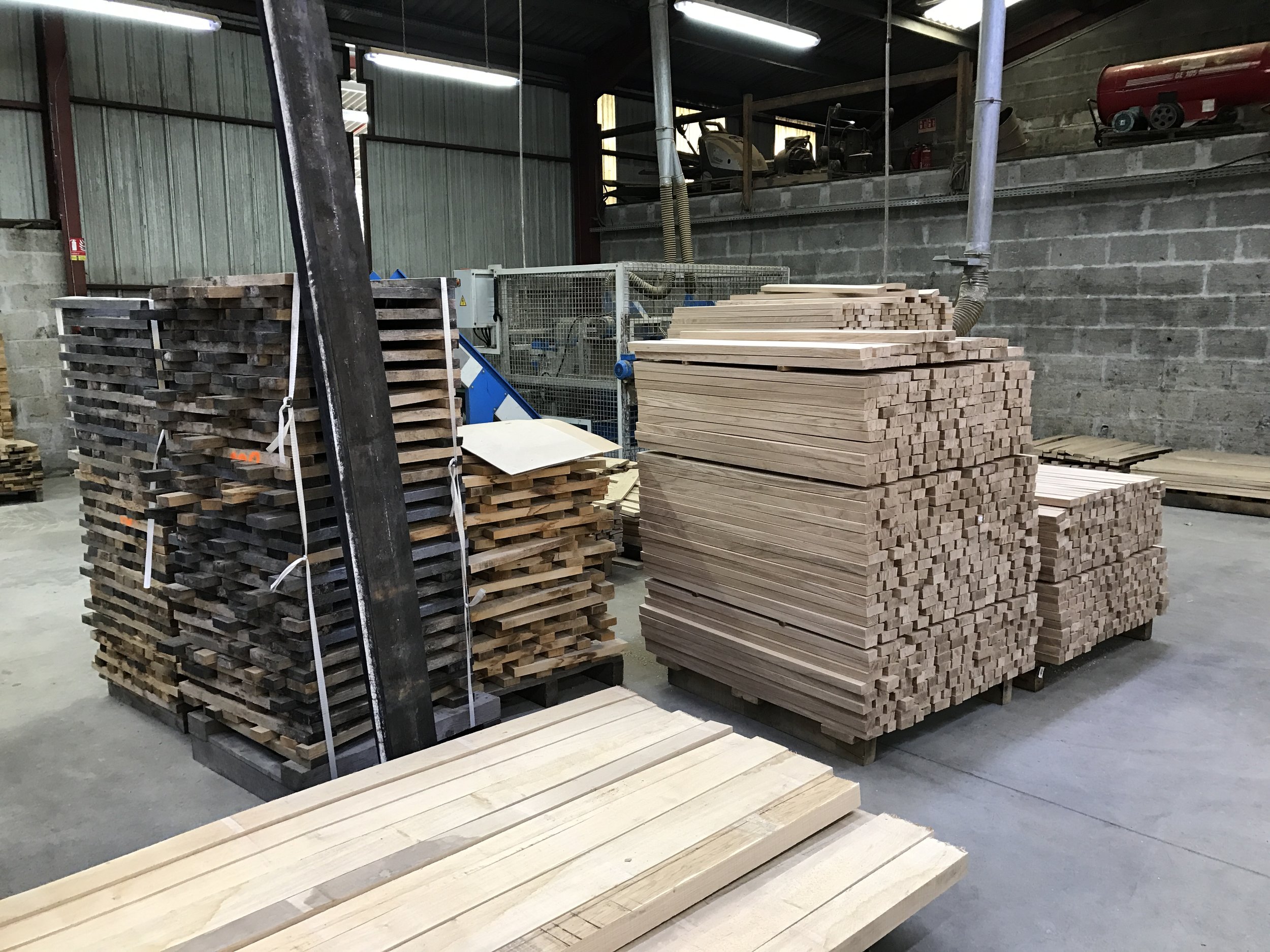 Stacks of milled oak at Tonnellerie Bossuet, waiting to be made into barrels