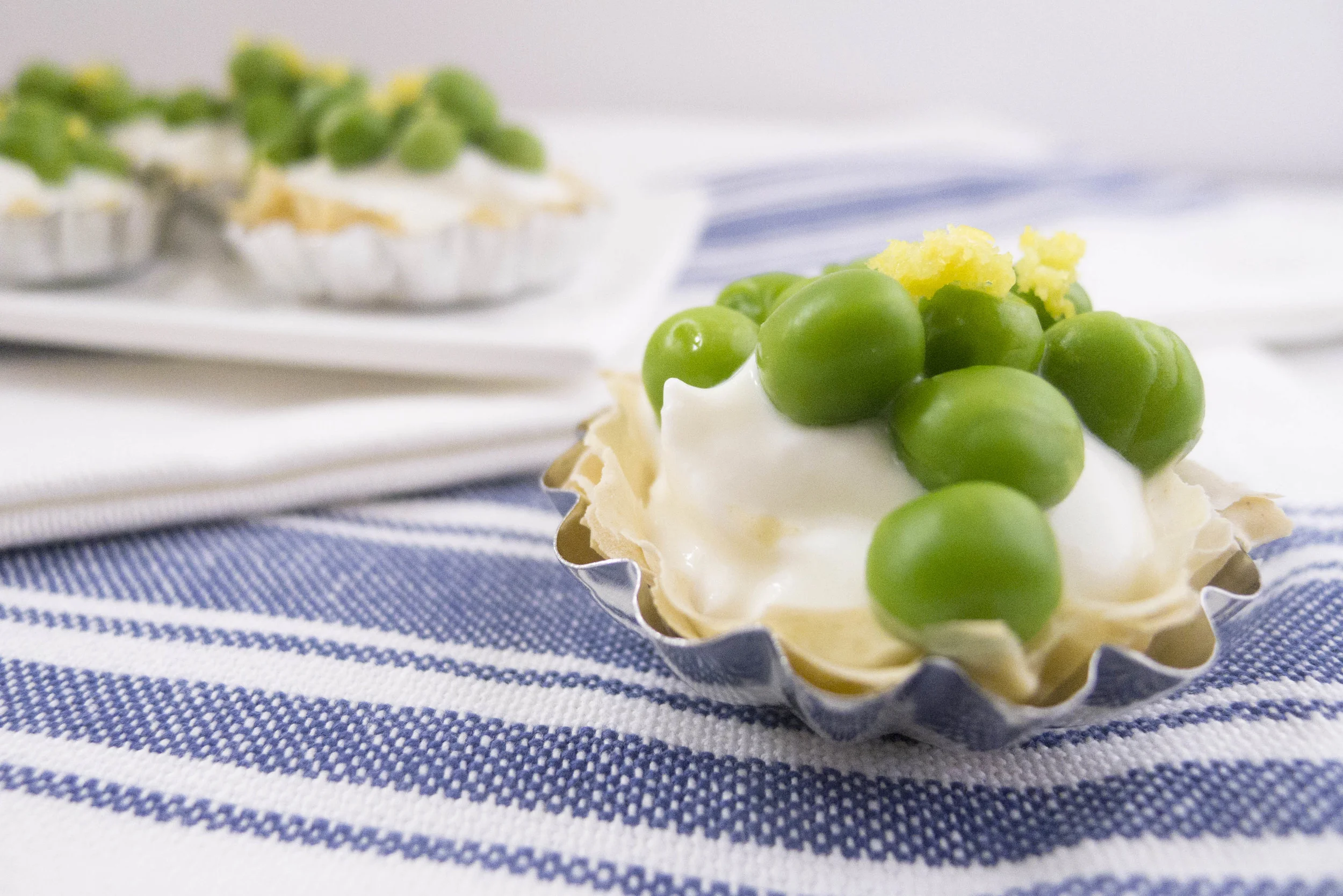 Light goat cheese and greek yogurt phyllo dough tart with spring peas and lemon