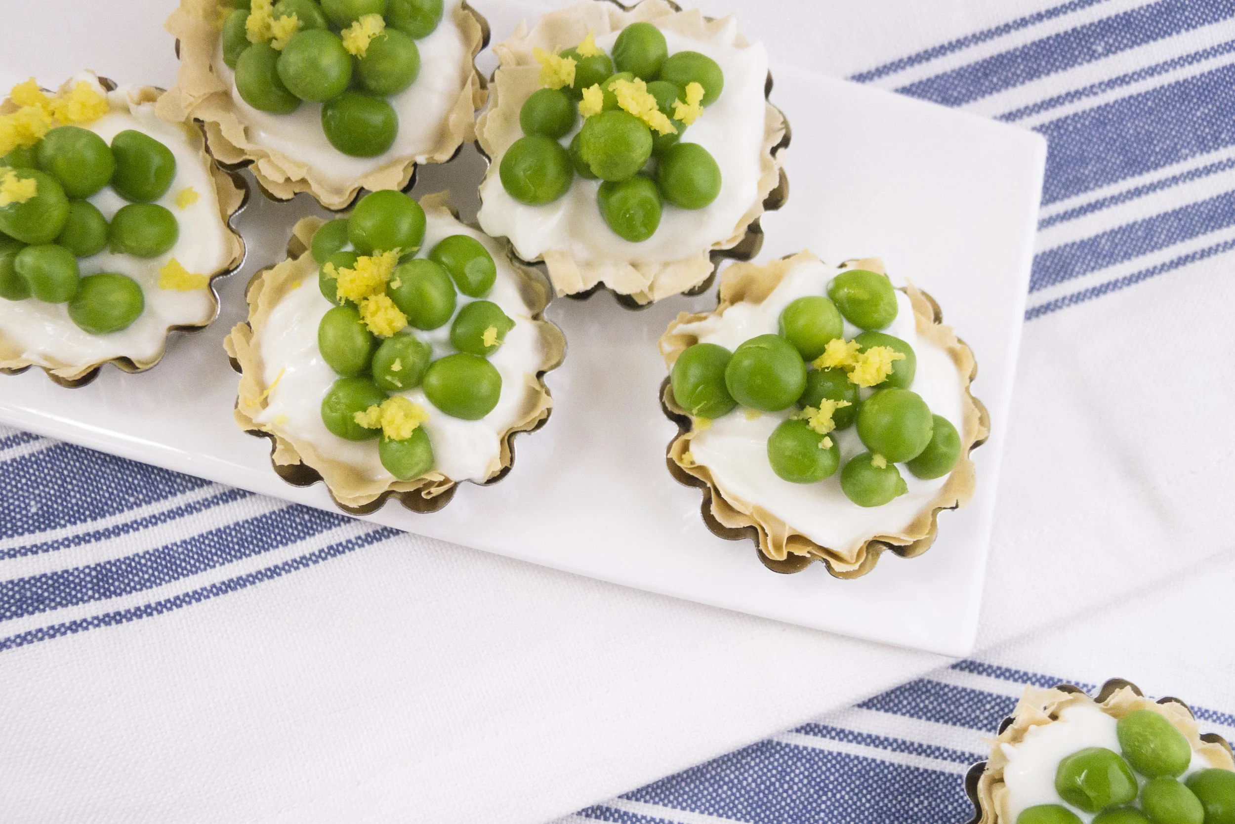 Light goat cheese and greek yogurt phyllo dough tart with spring peas and lemon