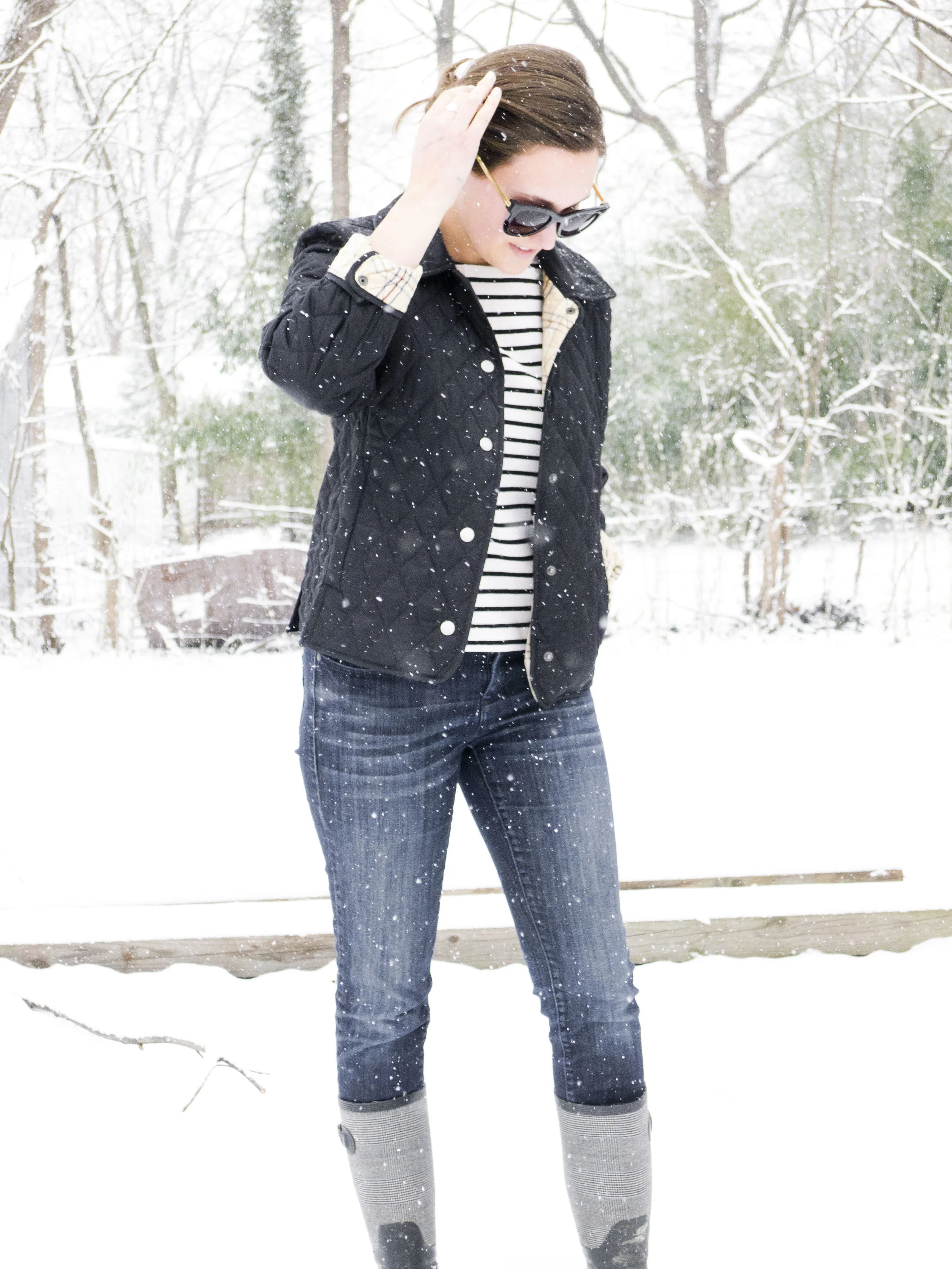 black and white striped shirt, boots, quilted jacket 
