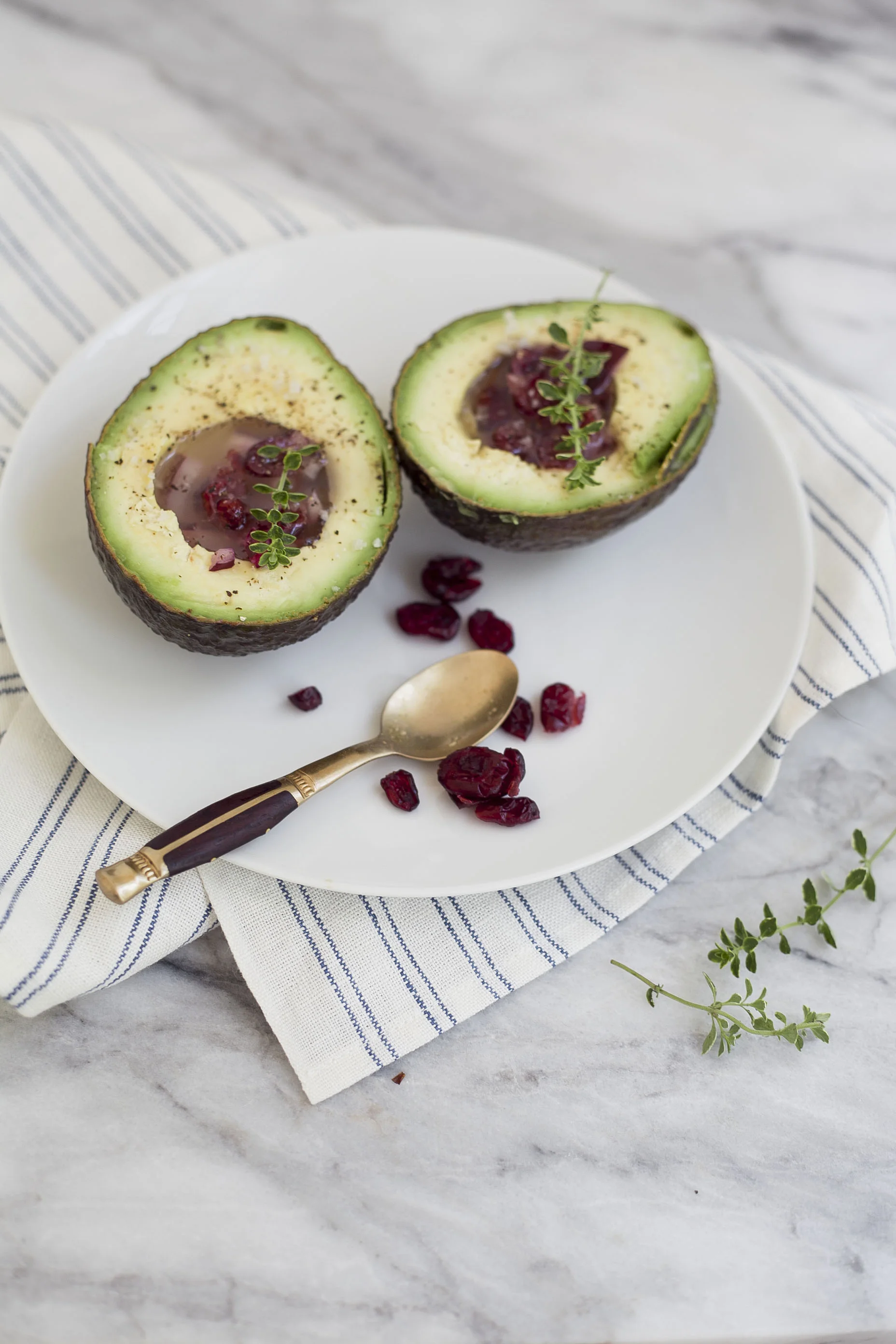 cranberry mustard dressing in avocado with lemon thyme 