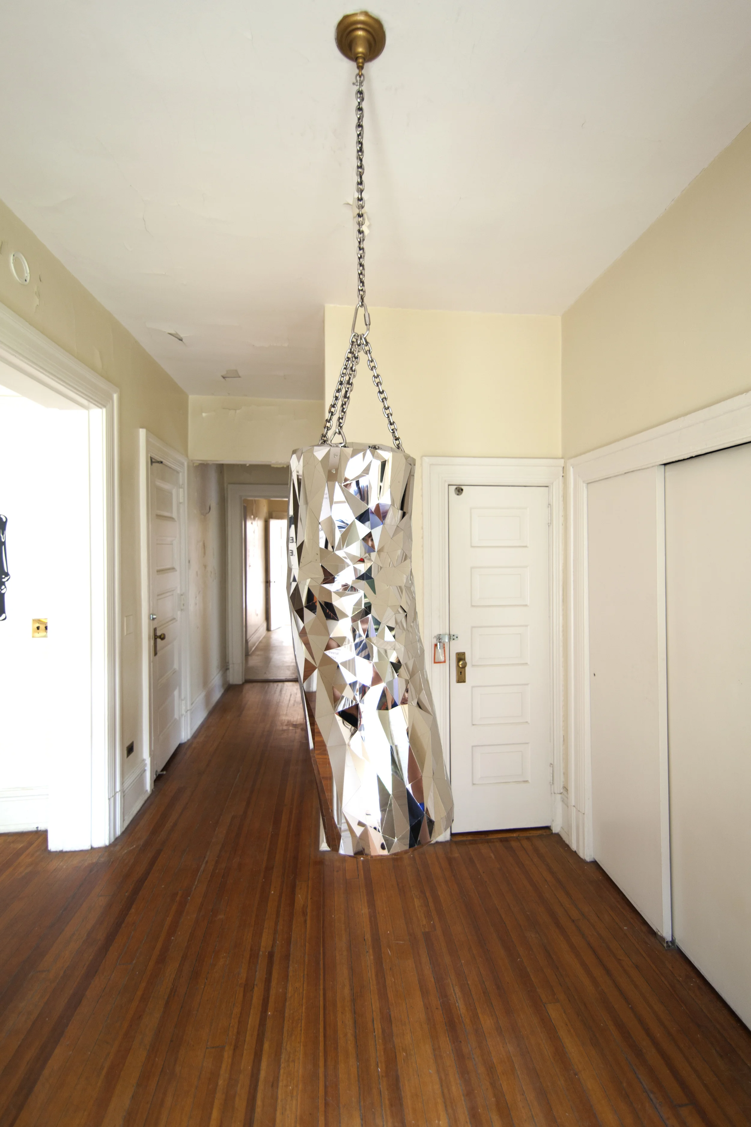 Heavy Bag, 2015, Mirror polished stainless steel, 40" tall (chain length variable) x 15" diameter