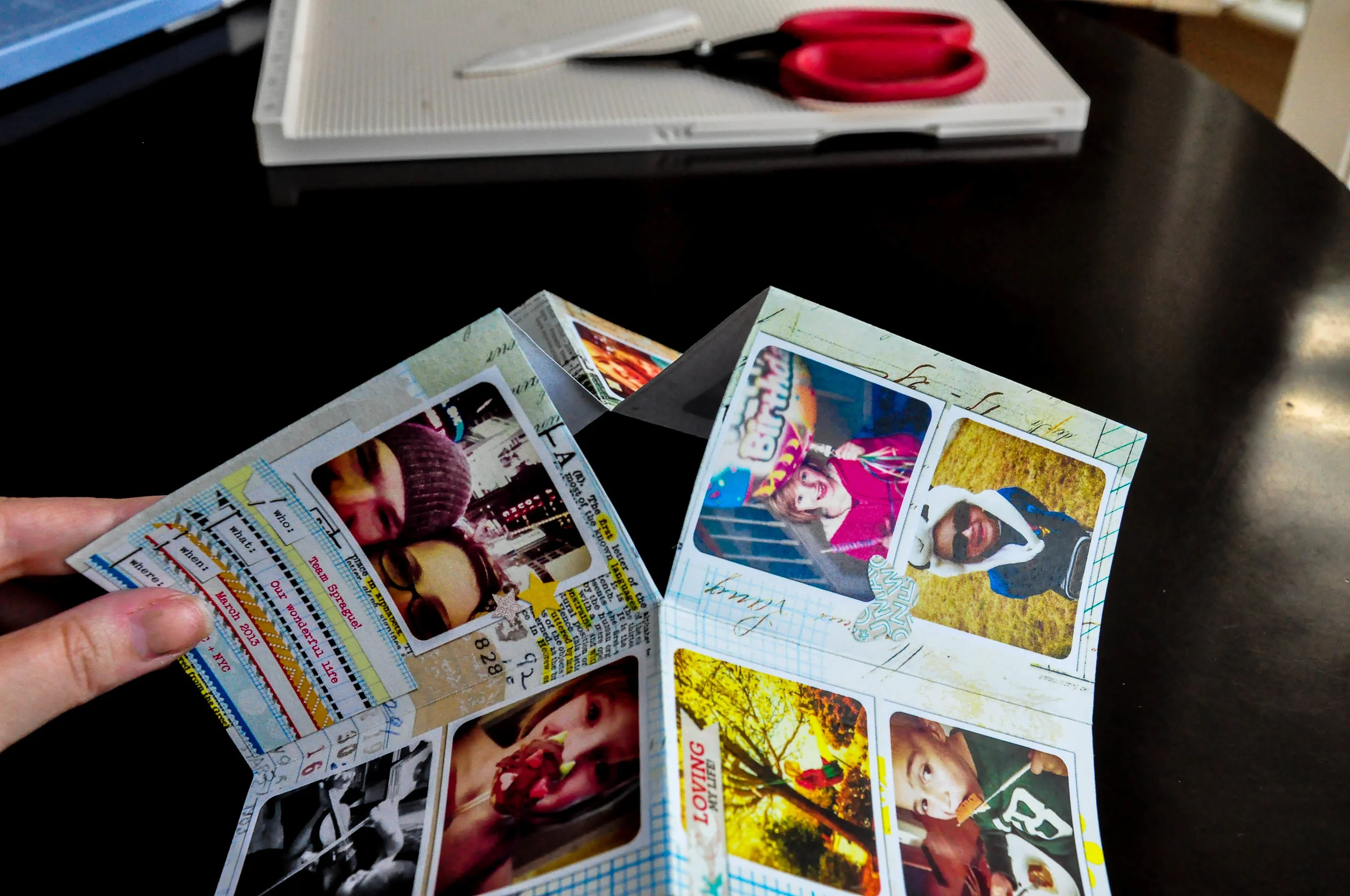 Pull the cut pieces away from each other and down, so the pages are now back-to back.