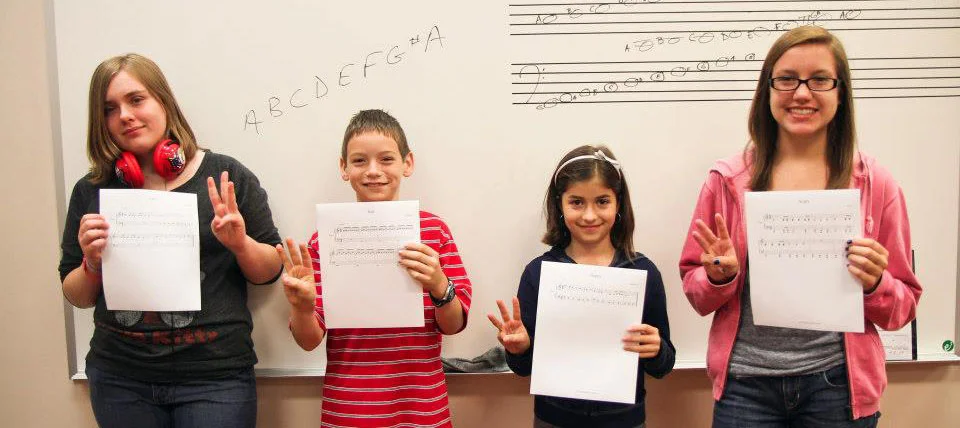 students in front of whiteboard.jpg