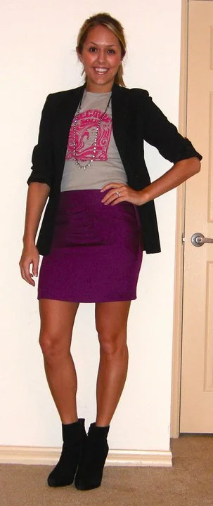 T-shirt: c/o Uhma Limited, $29.99 ( http://uhmastyle.com/womens/tshirts/electric-soul.html ) Blazer: Express Necklace: LOFT, $15 Skirt: Forever 21, $16 ( http://tinyurl.com/36stw4p ) Boots: Cynthia Rowley/TJ Maxx, $85