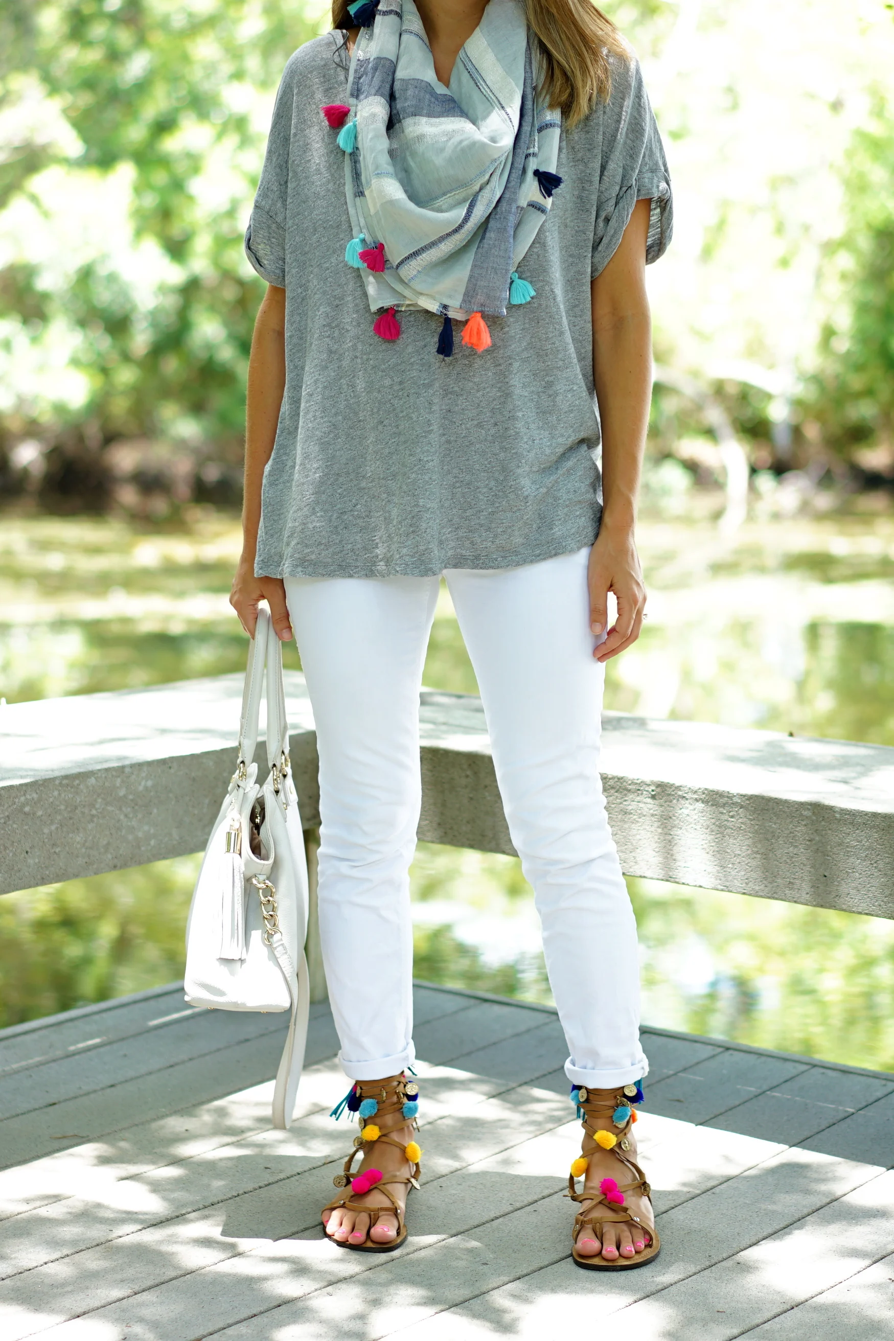 Tassel scarf, white jeans, pom pom sandals
