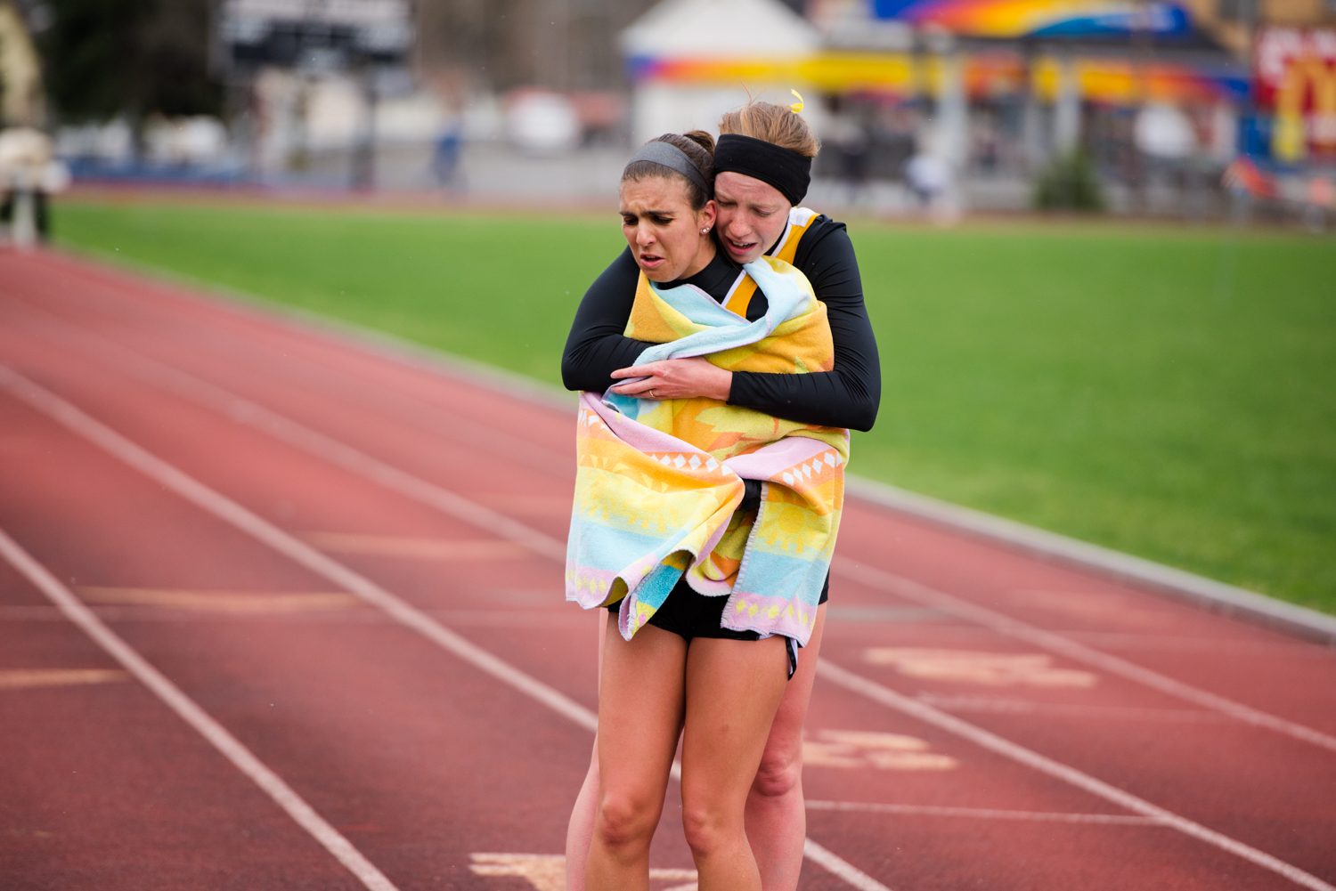 Two Geneva runners commiserate together after completing the steeplechase event.