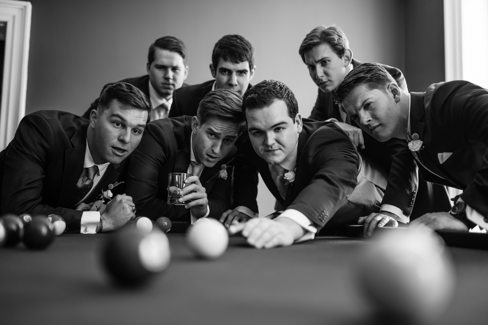 groomsmen playing pool