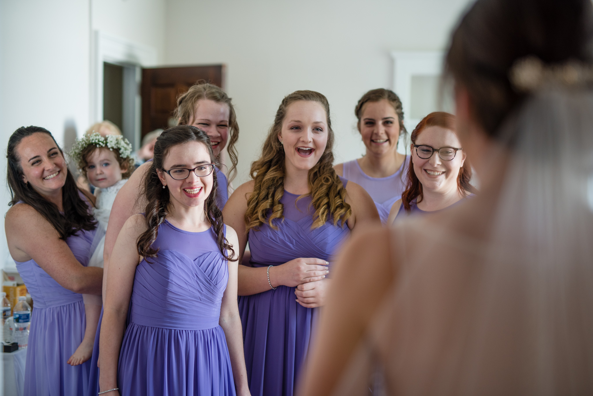 bridesmaids reaction to seeing the bride in her dress