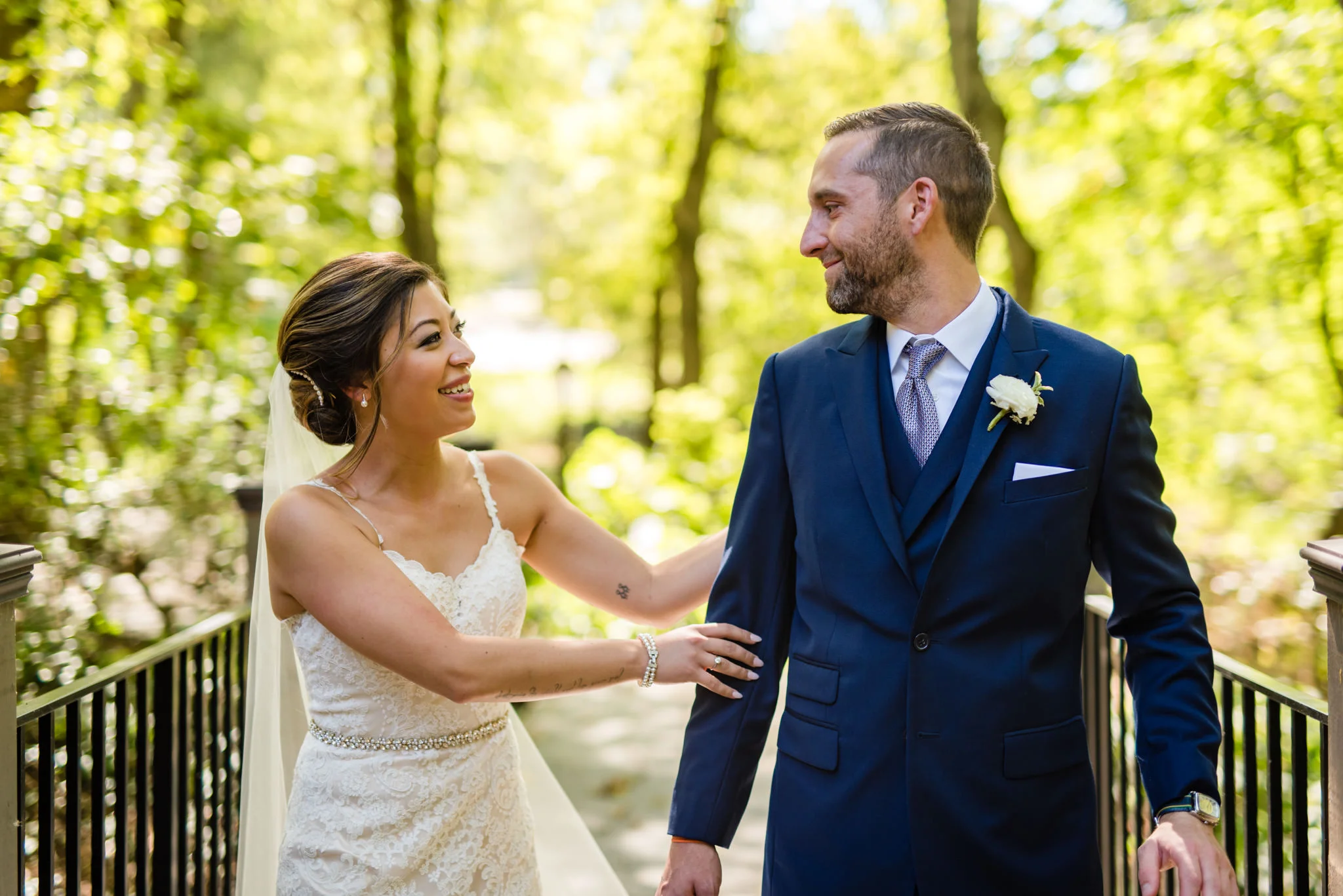  Wedding couple walking across a bridge 