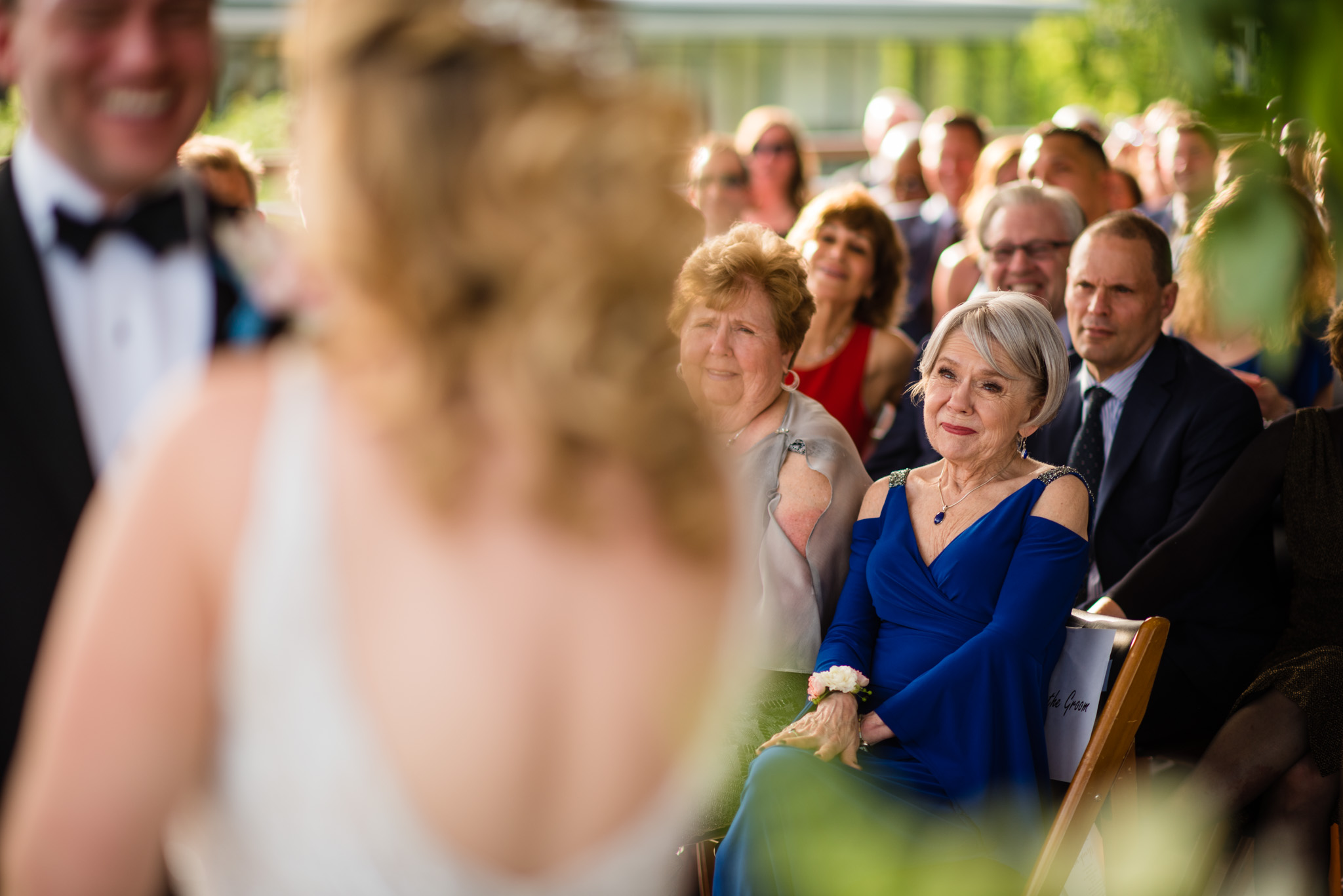 Mother of the groom watches her son getting married