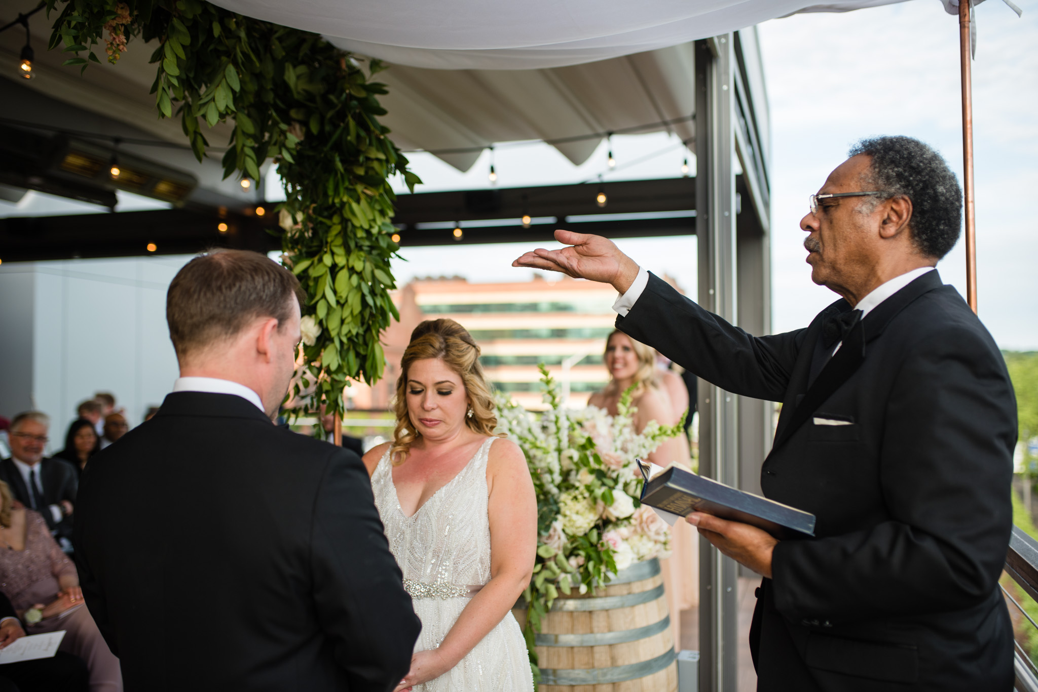 Officiant blessing the wedding rings