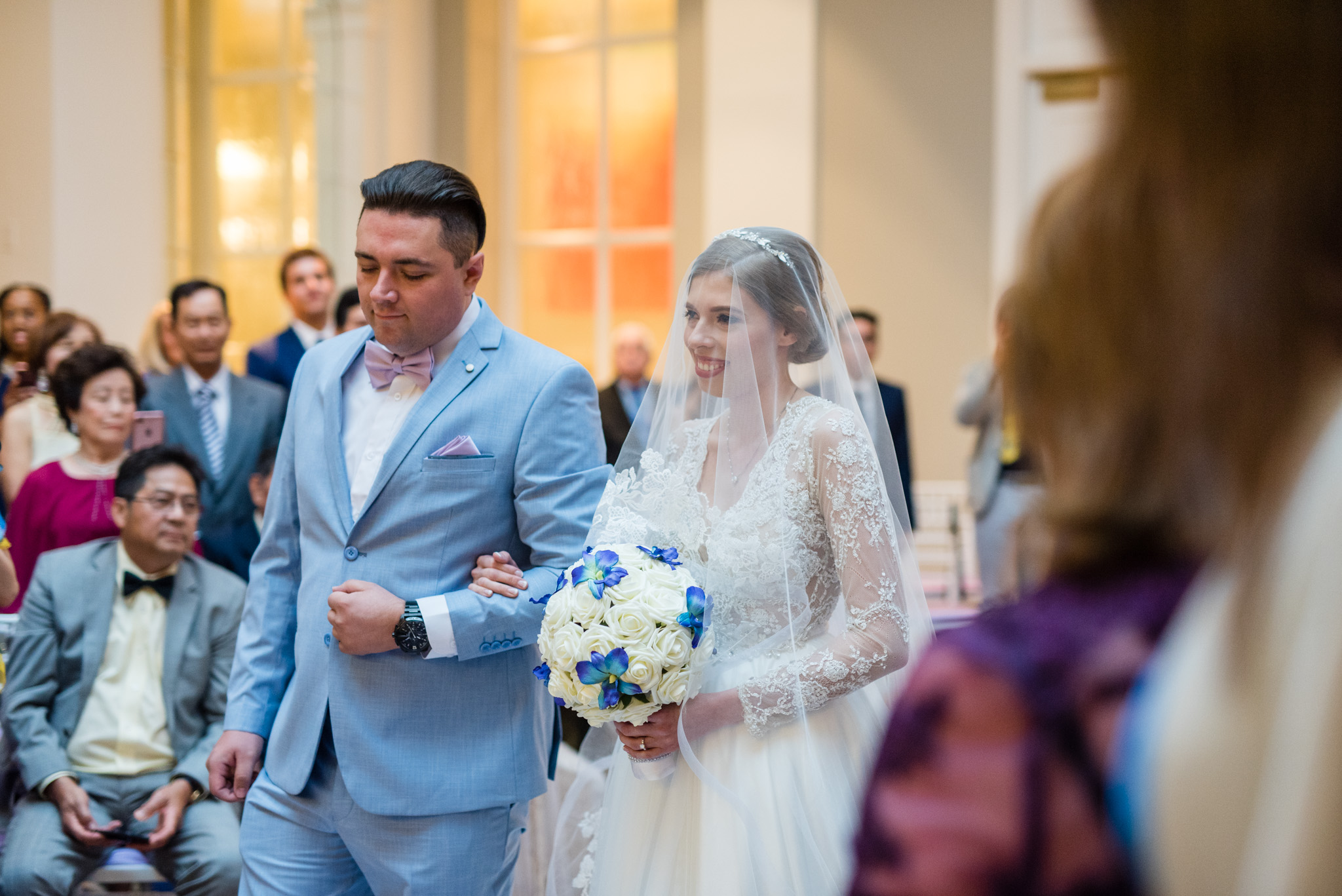 Bride walking down the aisle at her ceremony at the Mayflower Hotel in Washington DC