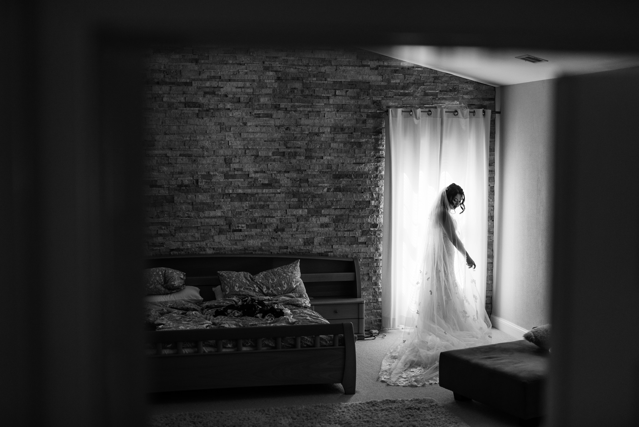 Bride enjoys putting on her wedding dress