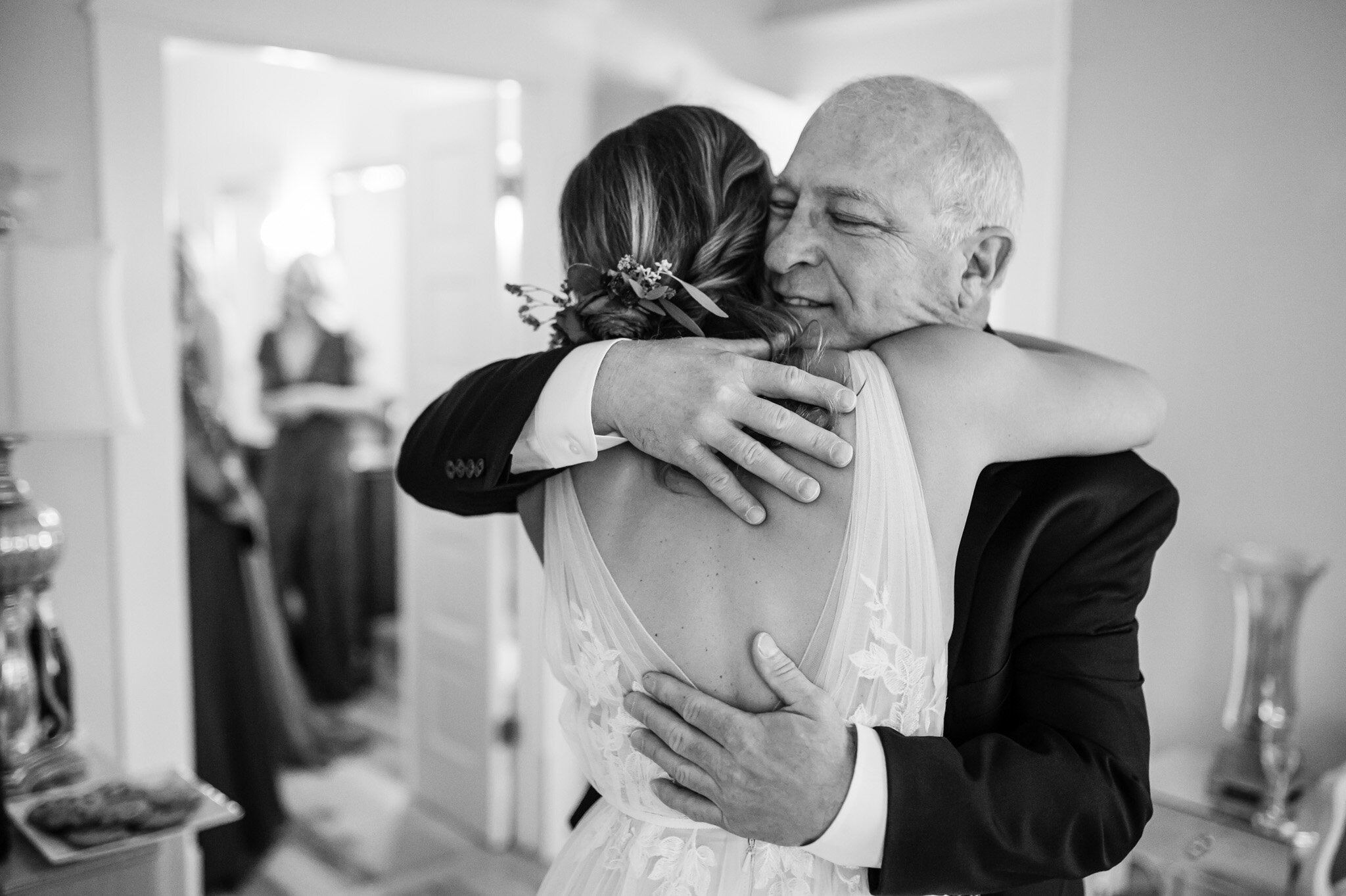 Bride hugs her father on her wedding day