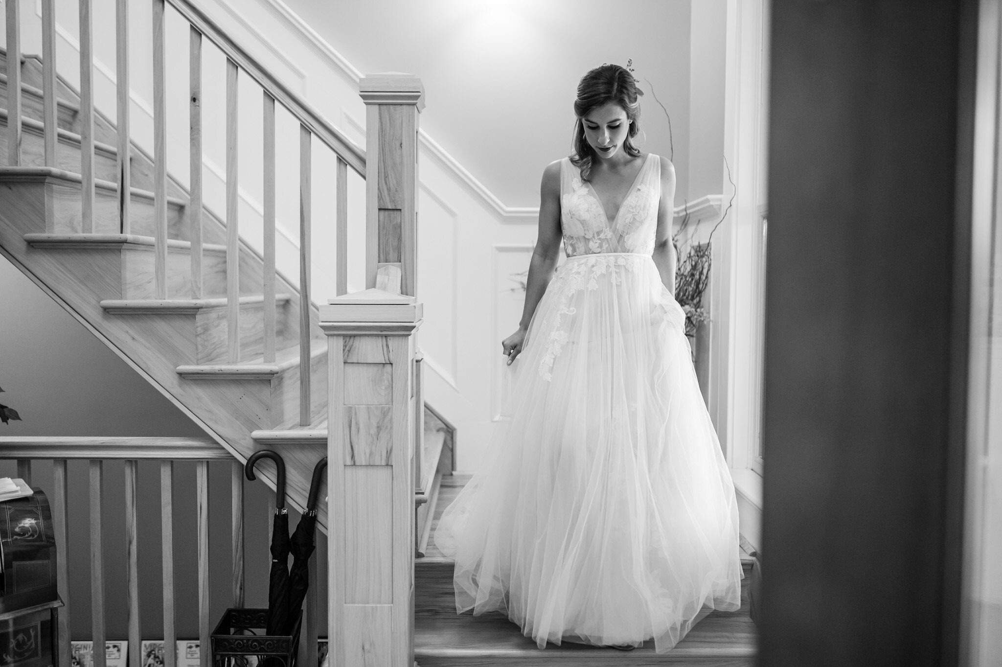 Bride walks down the stairs at Walden Hall