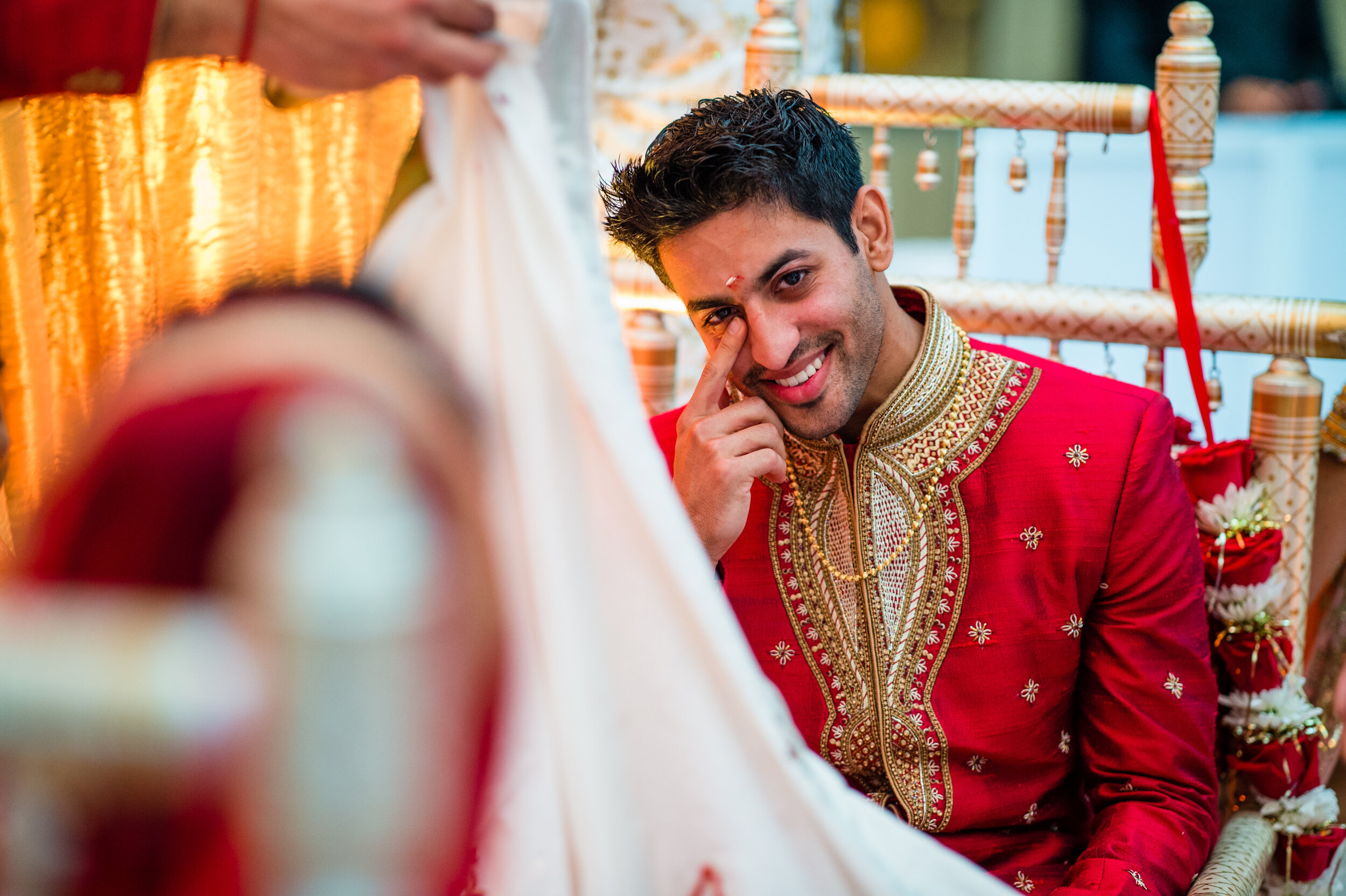  The groom wipes away tears at the vidai during his wedding