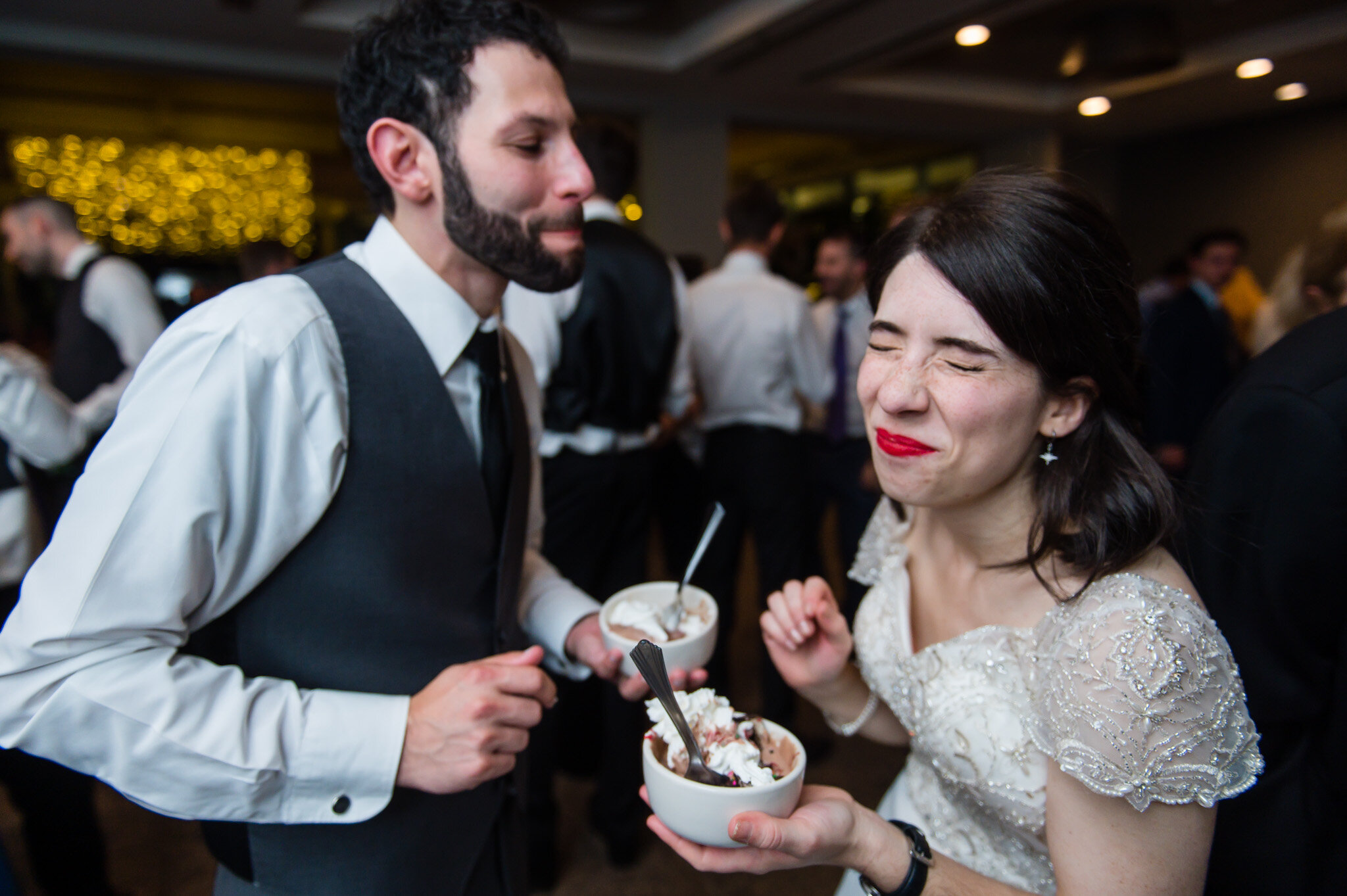 The bride and groom enjoy Sundae's together at their wedding reception