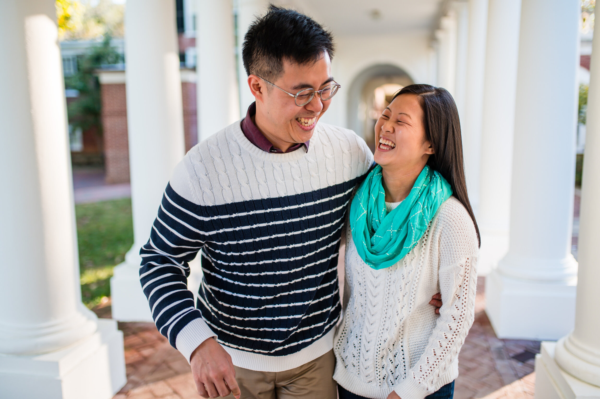 A couple laughs and enjoys time together at their UVA engagement session