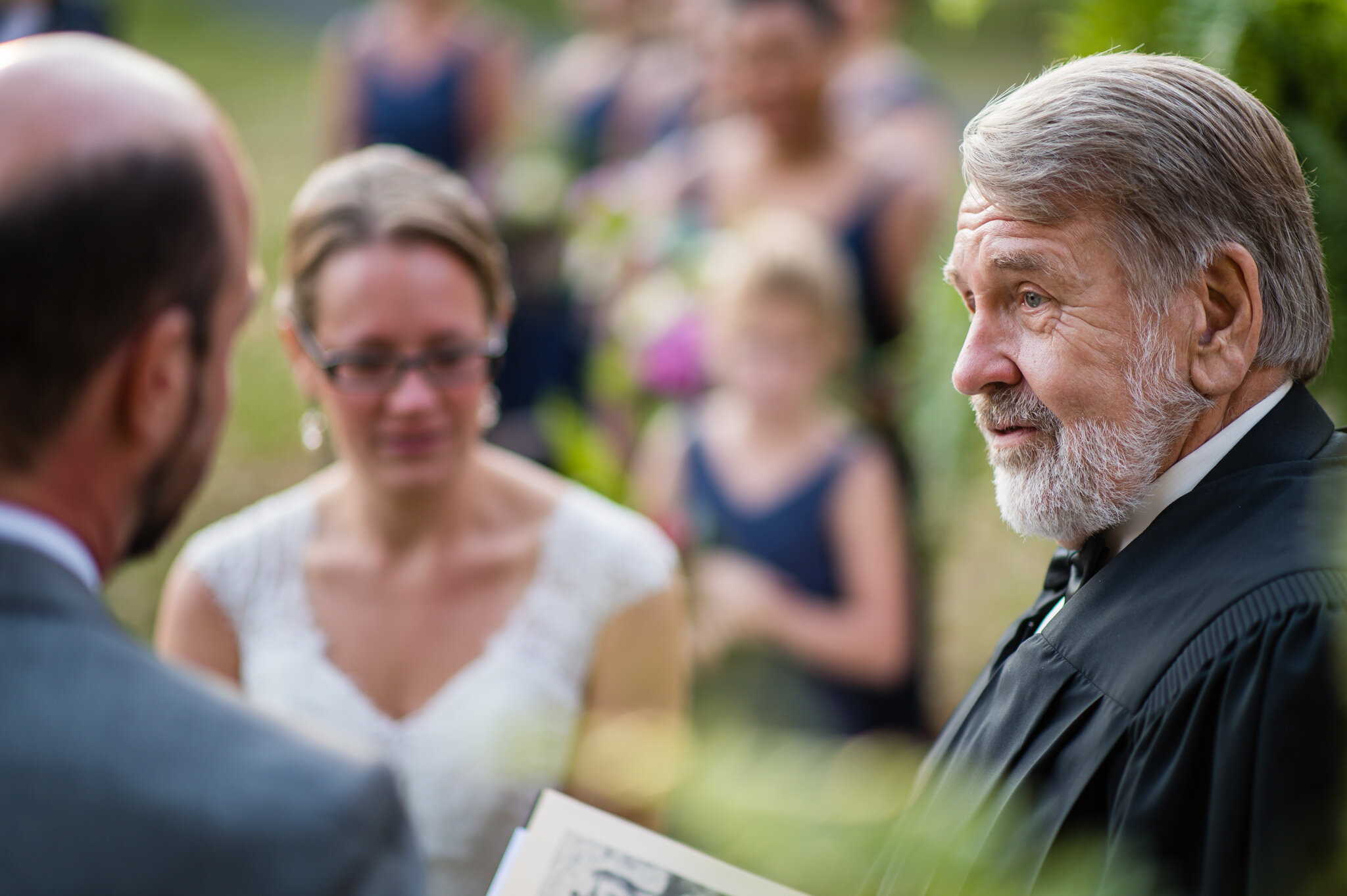 The wedding couple in front of the minister