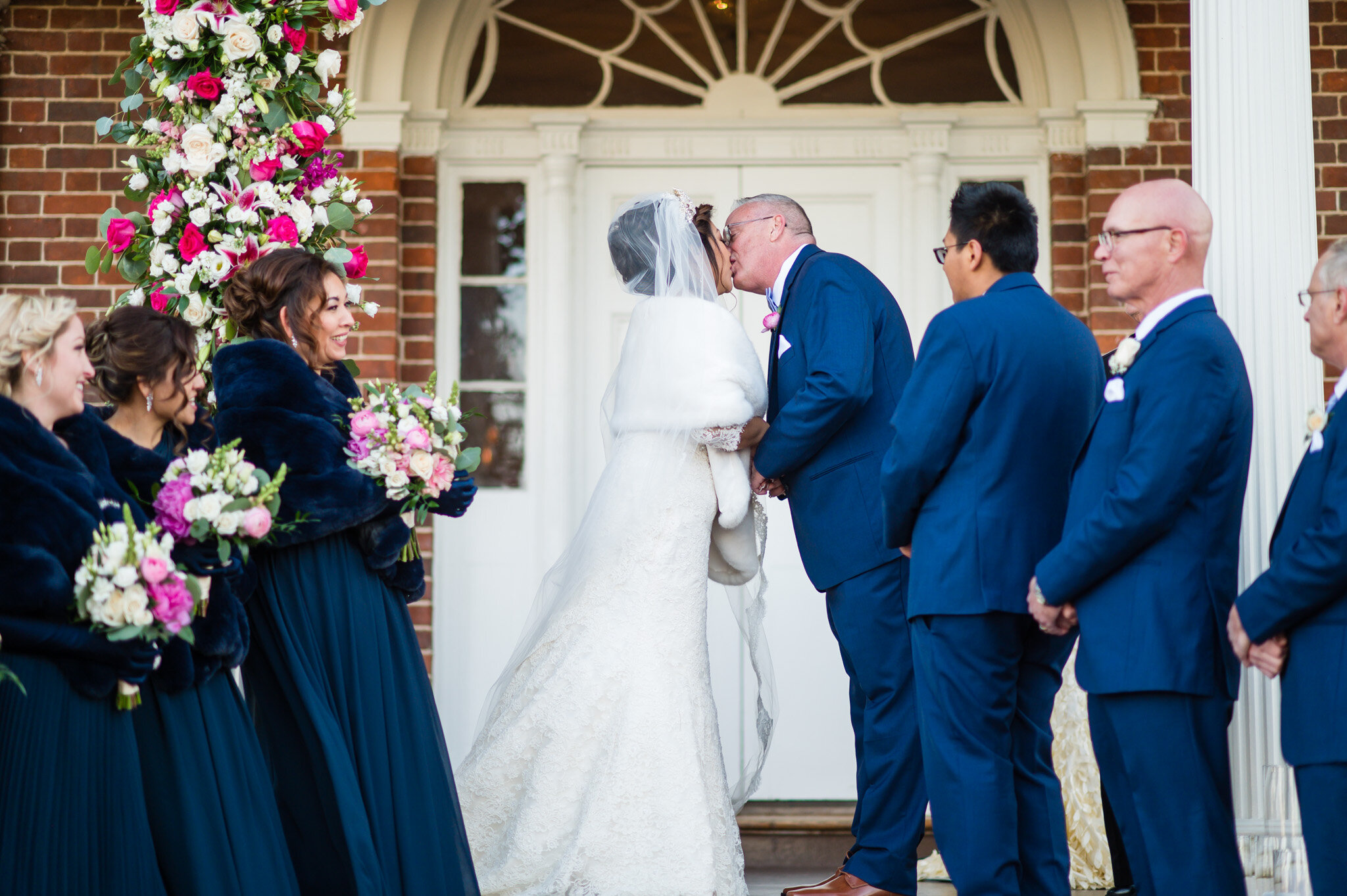 bride and groom share their first kiss on their wedding day