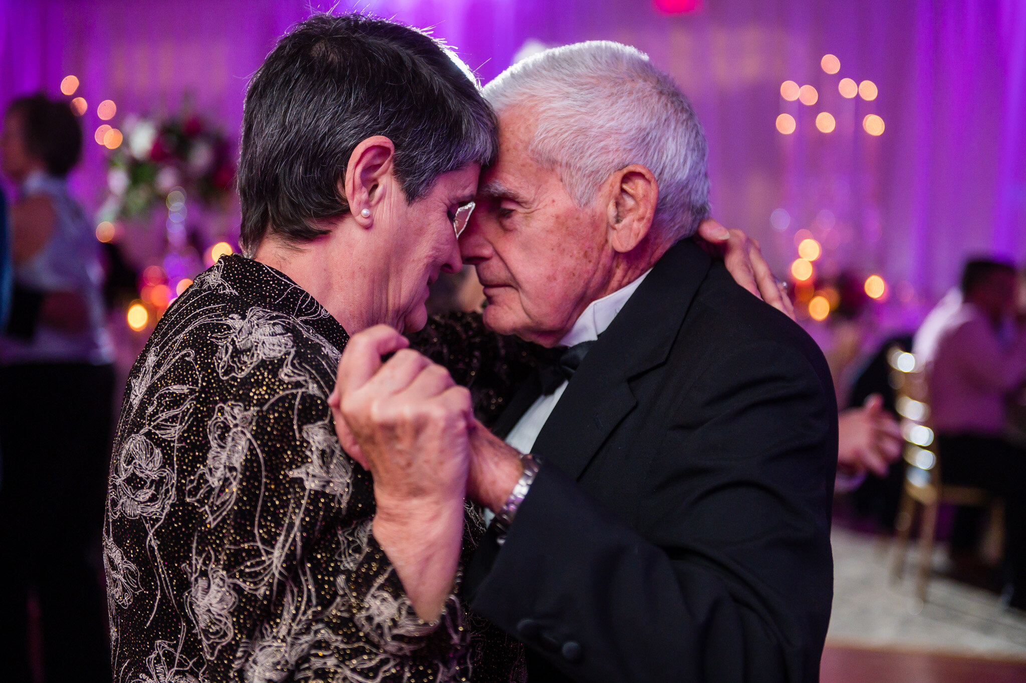 Older couple dancing together at wedding reception in Virginia