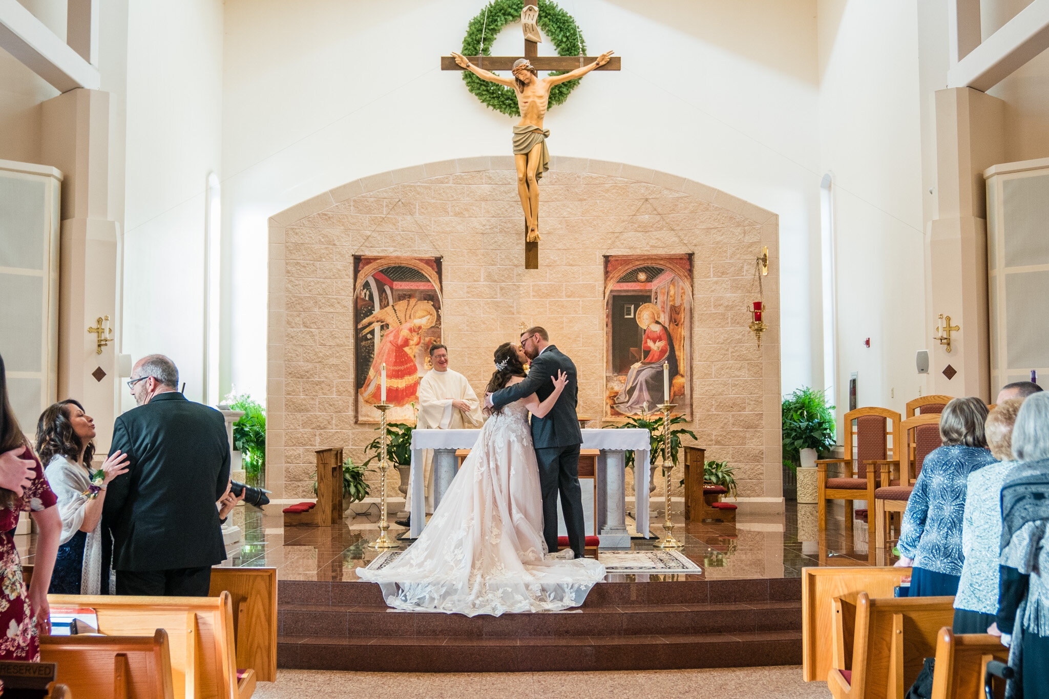 Bride and groom share their first kiss.