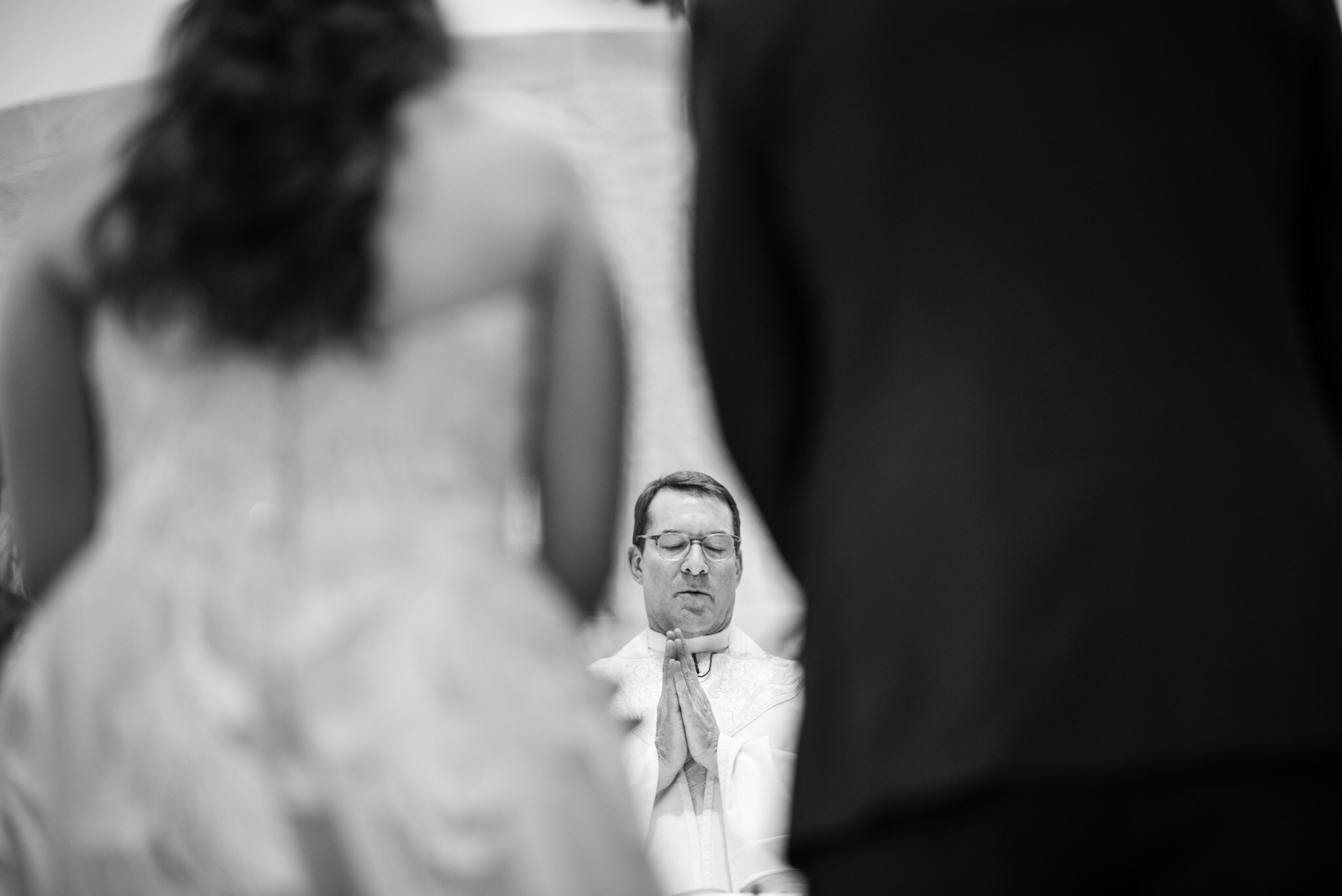 Catholic priest performing a wedding ceremony.