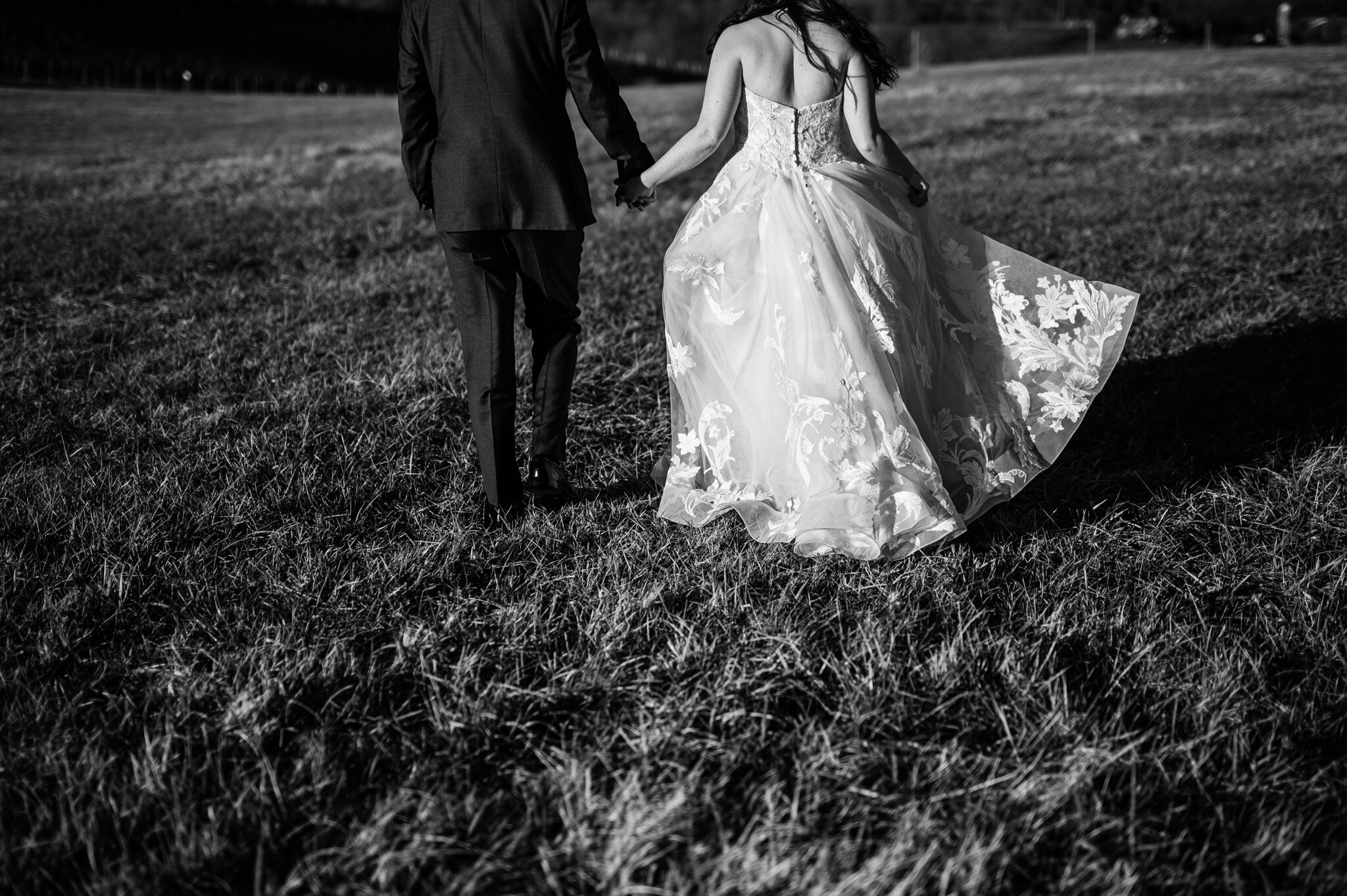 The bride and groom walking together after their wedding ceremony