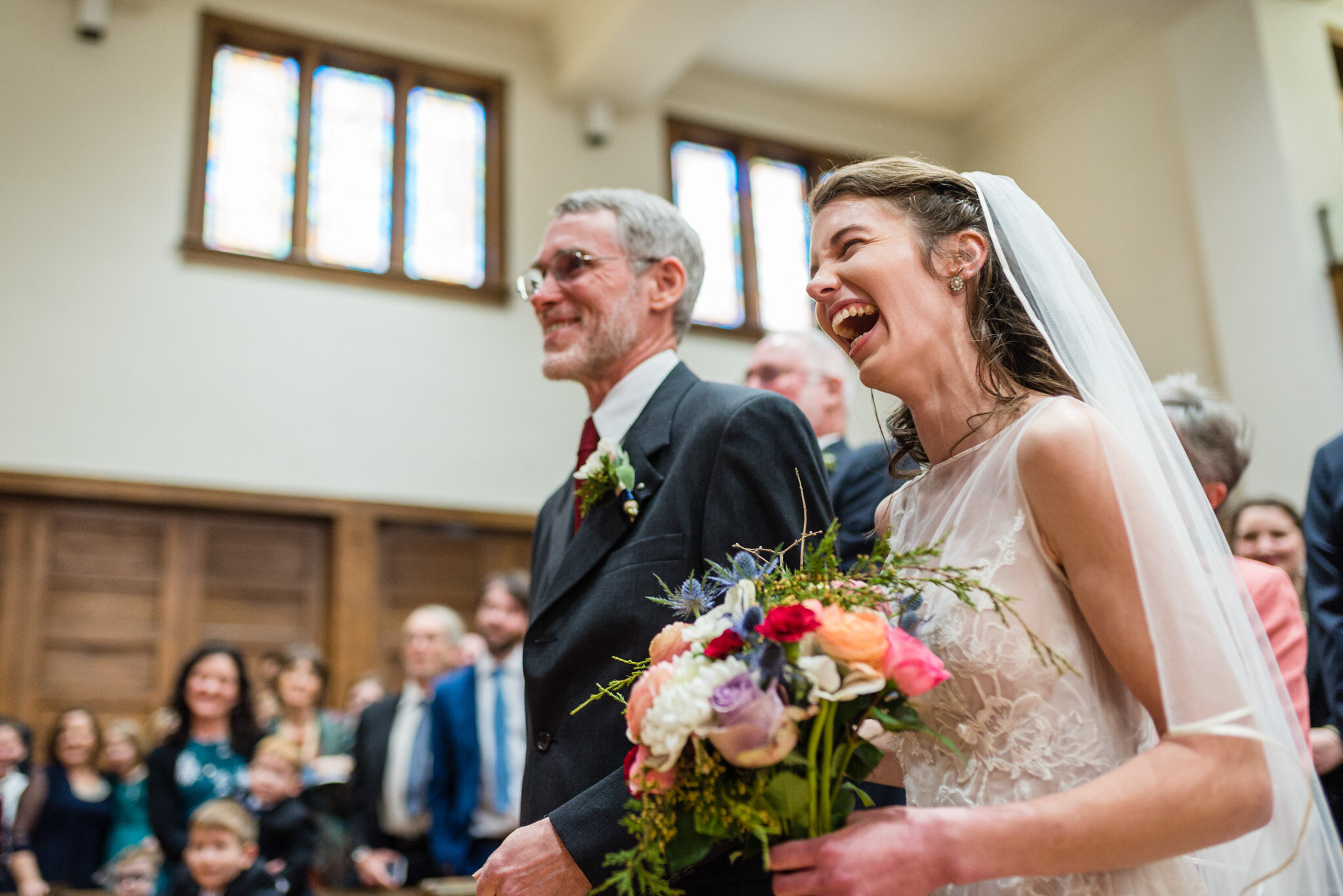 The bride laughs during her wedding ceremony