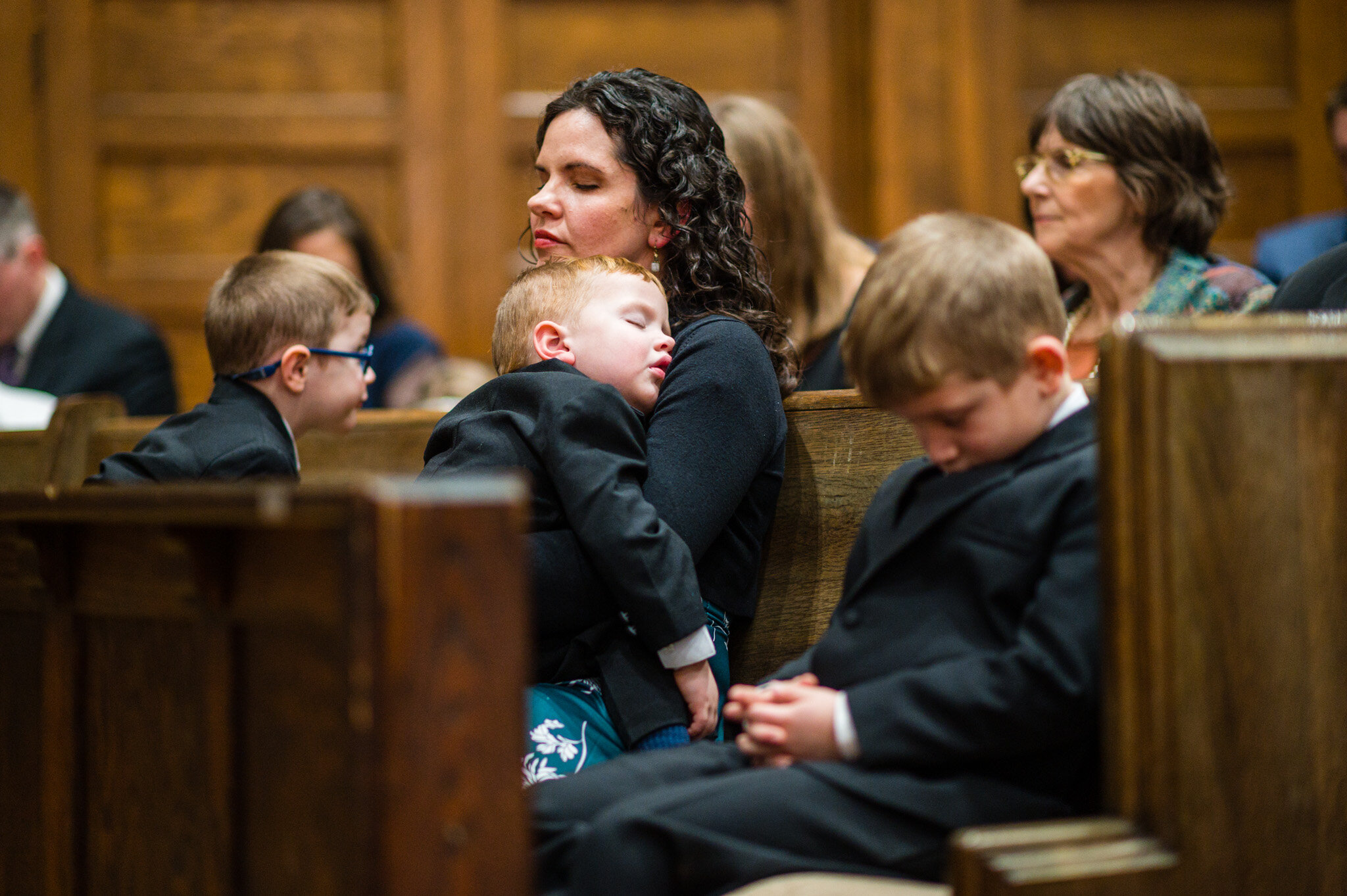 A sleeping child at a wedding ceremony