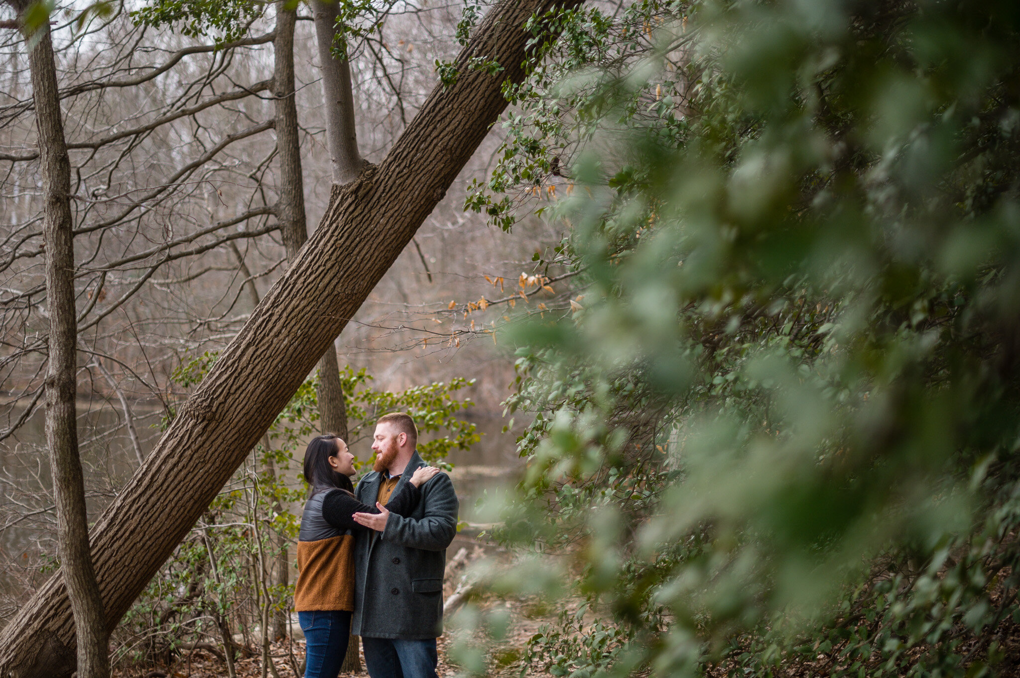 A couple enjoys time together at their engagement session at Burke Lake